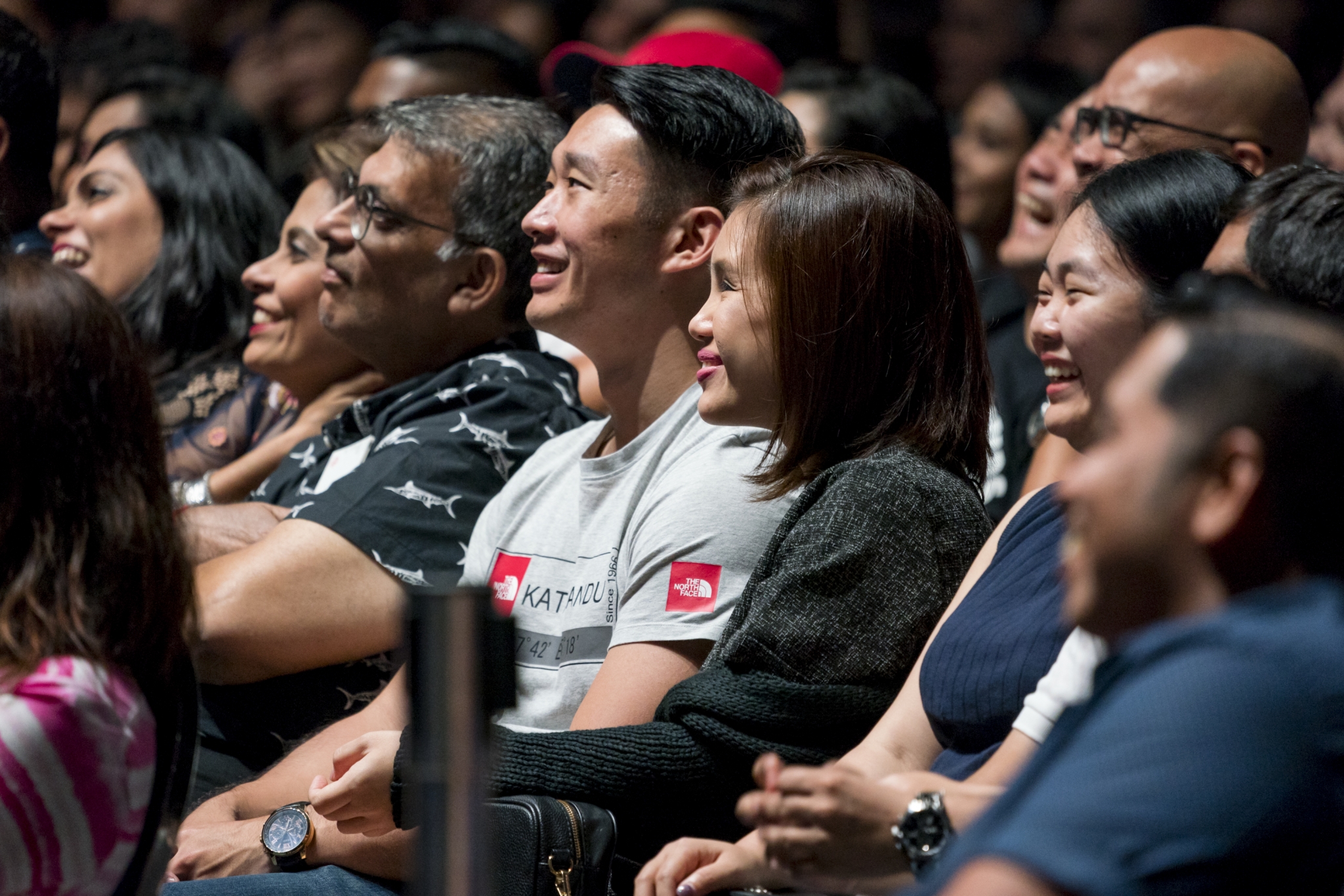 Enraptured audience laugh at Russell Peters' jokes