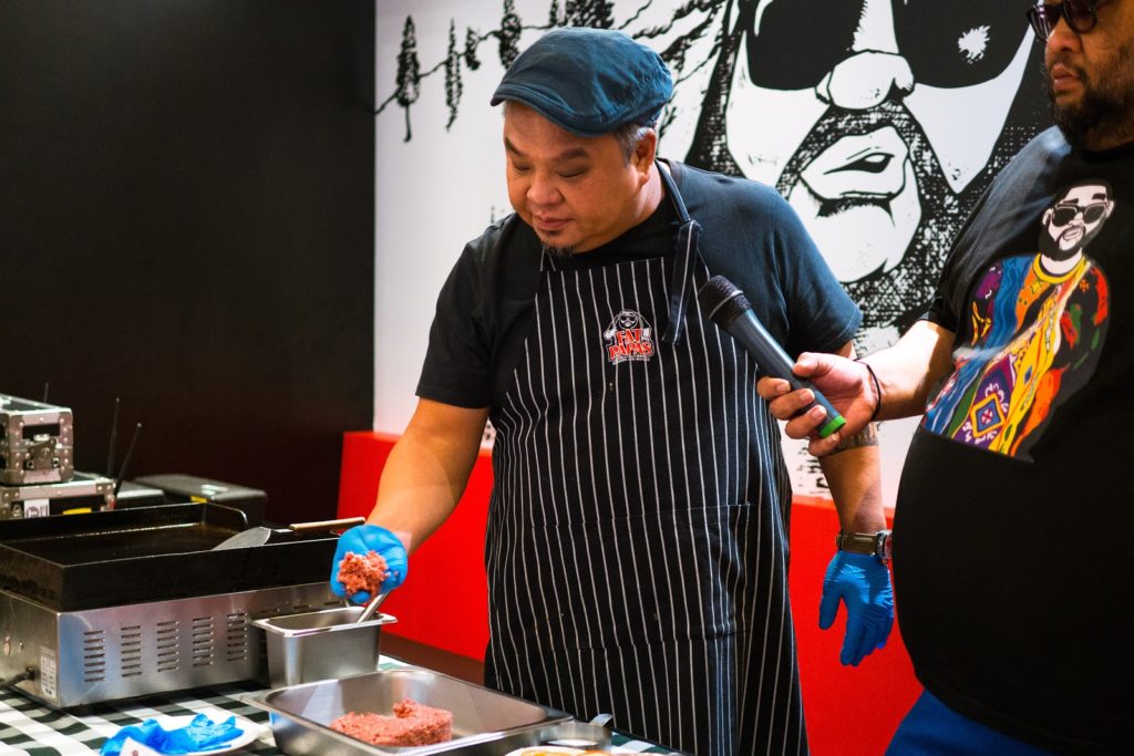 Sustainable meat- chef preparing burger patty at Fat Papas