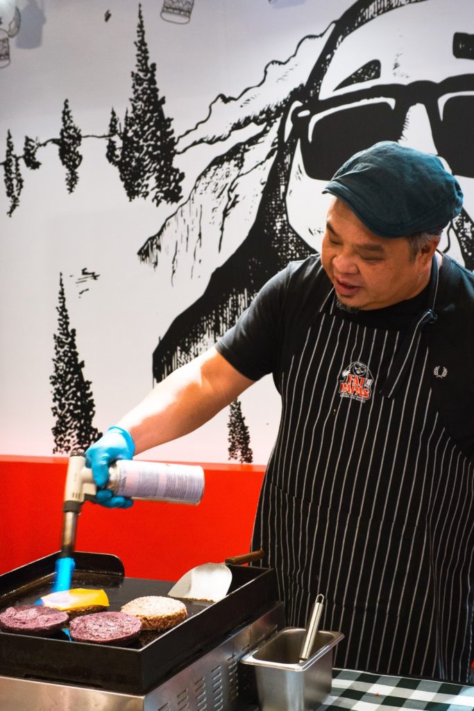 Sustainable meat- chef cooking burger patty at Fat Papas with no seasoning