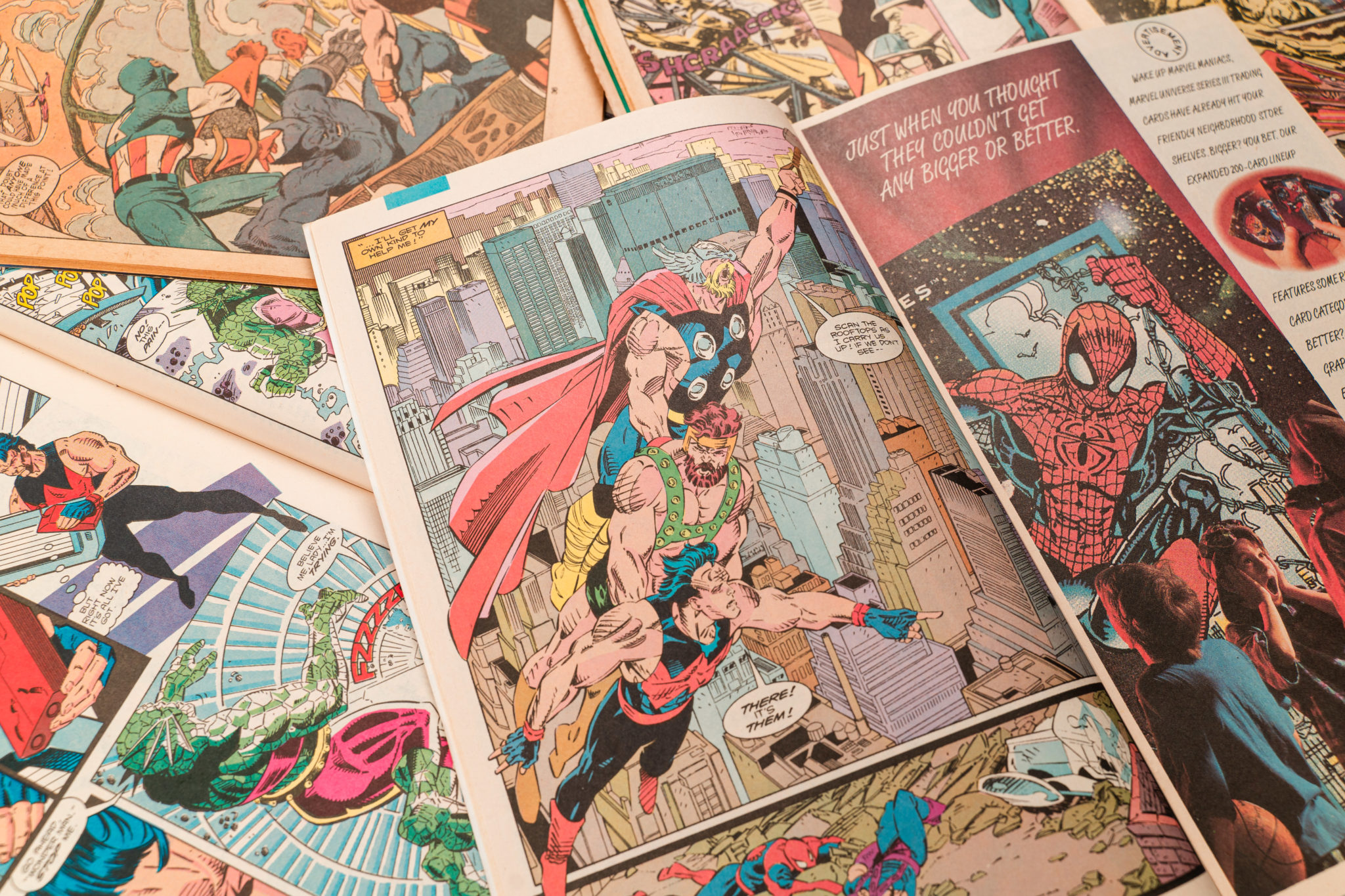 An open spread of an old Marvel comic with Spider-Man