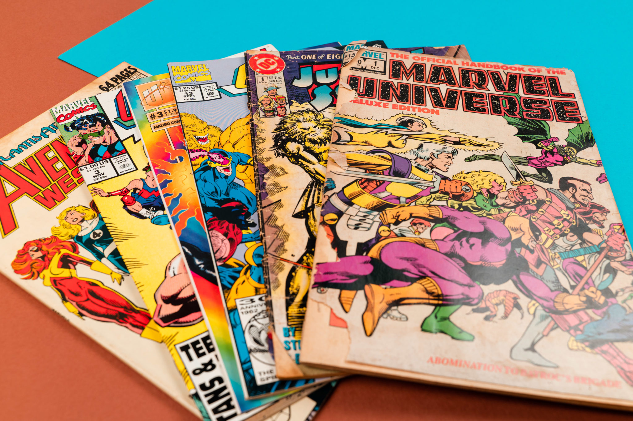 A stack of 1980s and 1990s Marvel comics