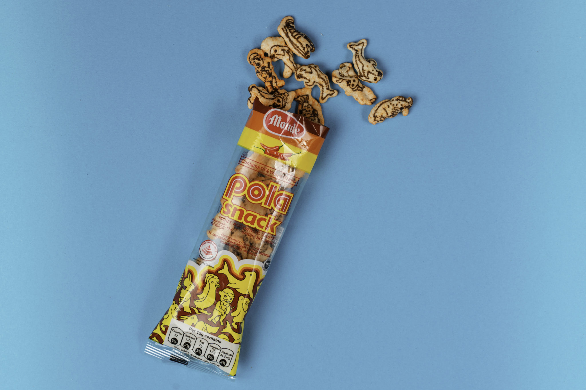A packet of Pola biscuit snacks with biscuits spilling out