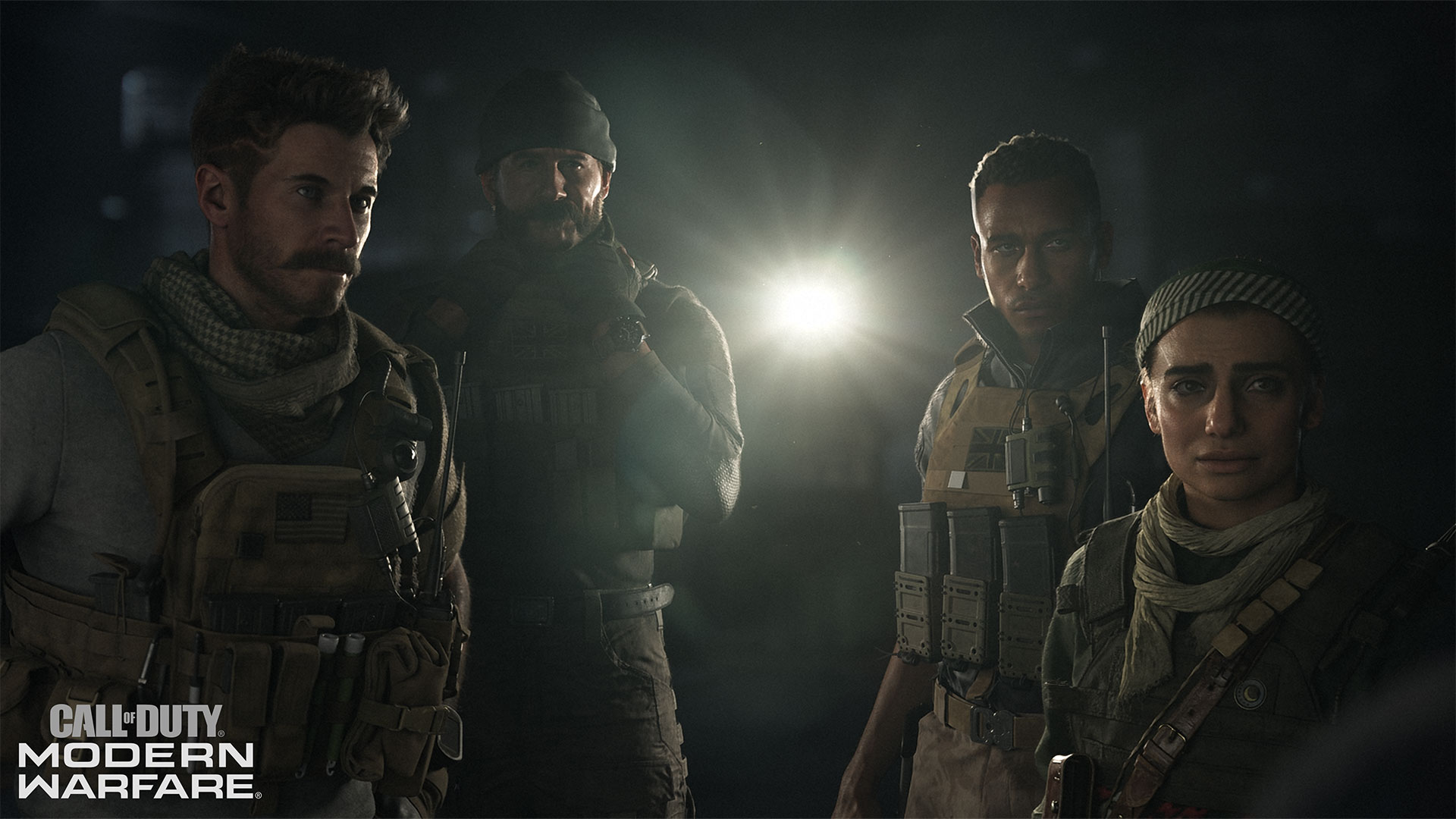 Four soldiers lit by a torch in the dark in Call of Duty: Modern Warfare