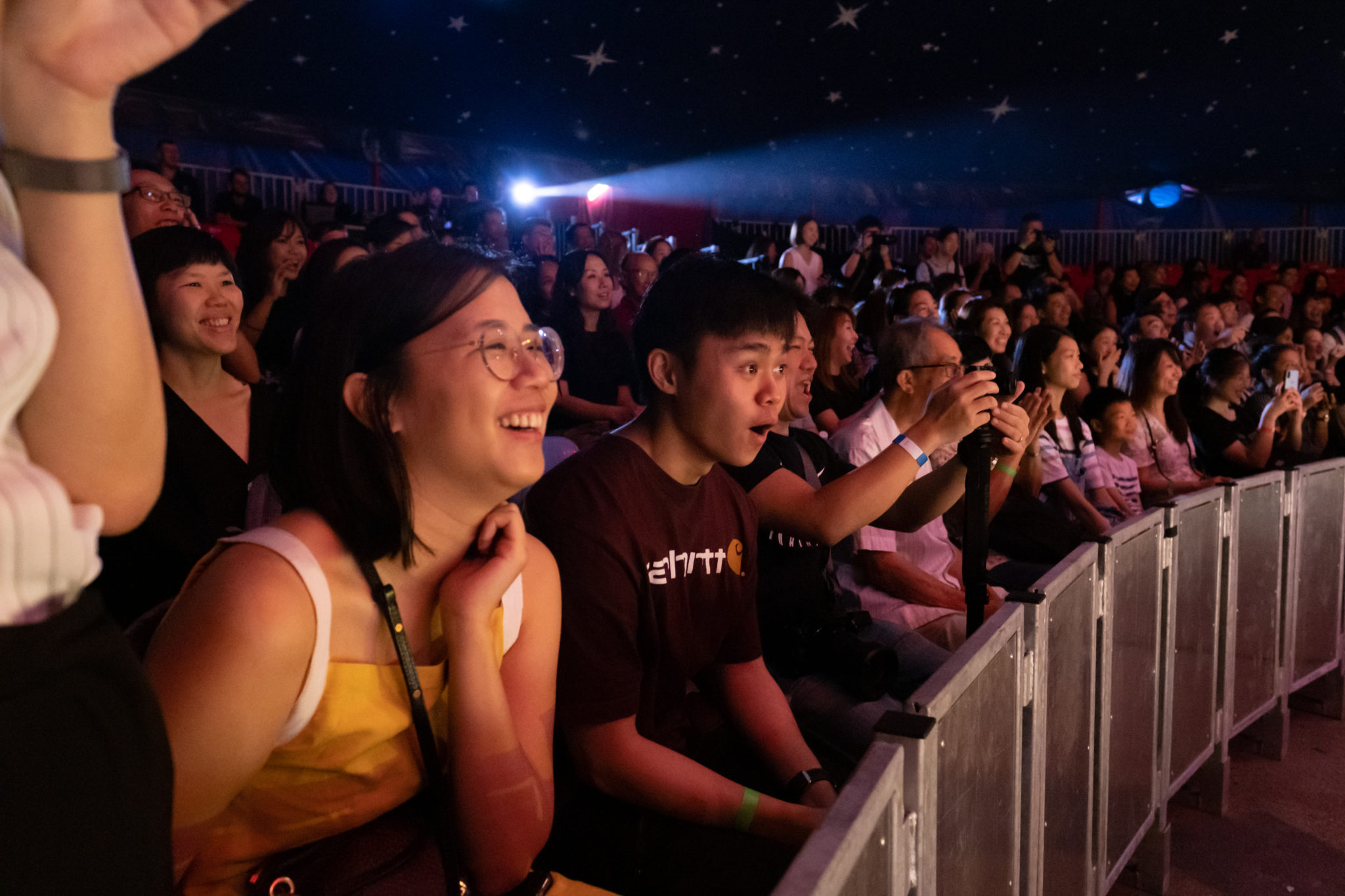 Audience members laughing as they watch The Great Circus of Europe
