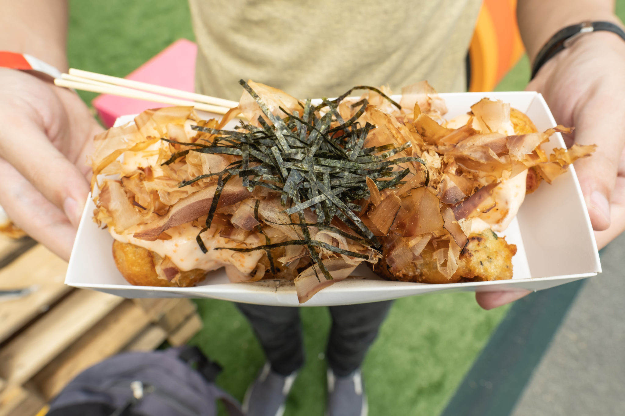 A tray of Mentaiko Takoyaki topped with bonito flakes