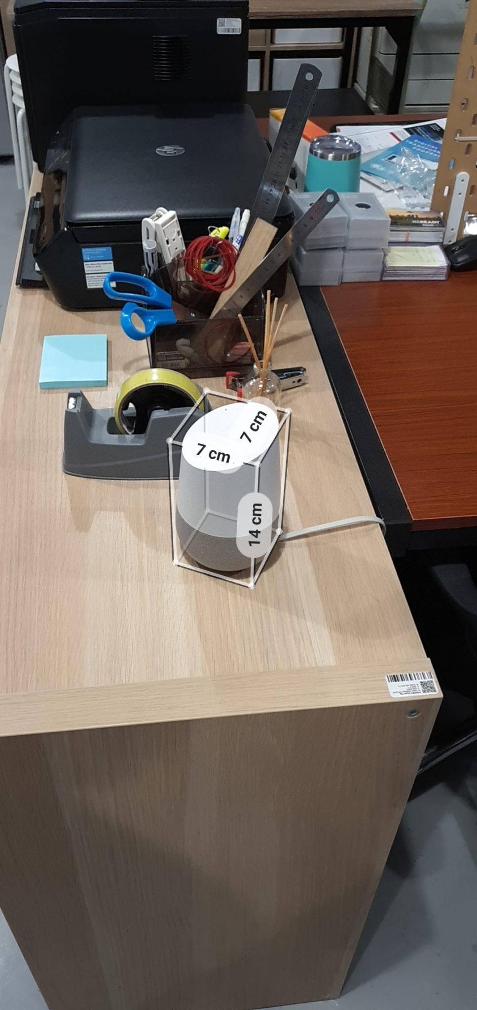 A white charger sitting on a desk