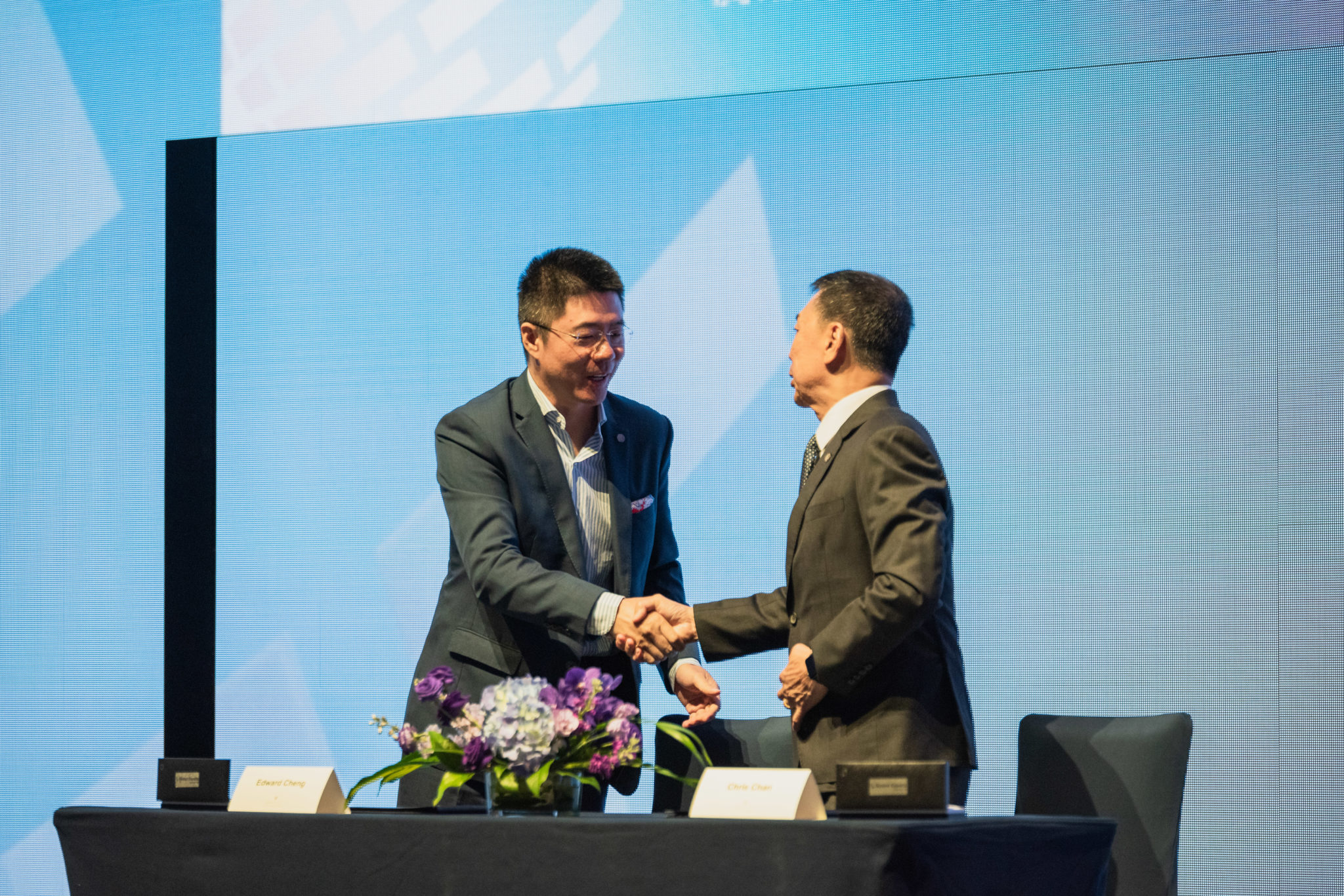 Two men shaking hands at the signing of Tencent as Founding Global Partner of the Global Esports Federation