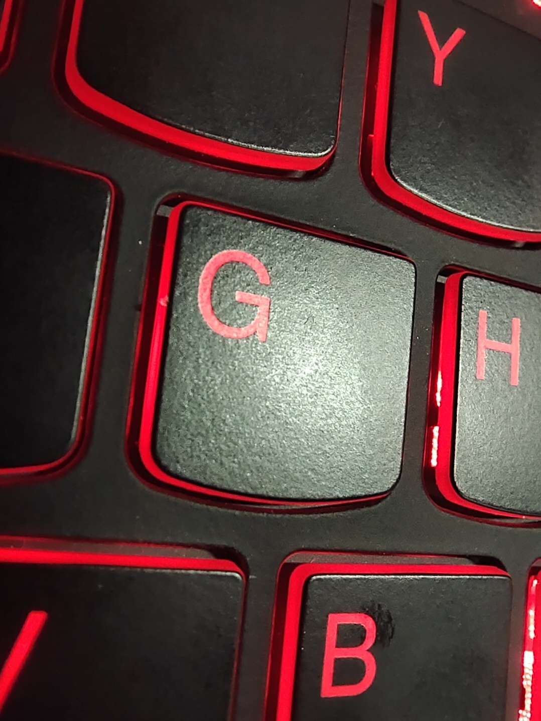 A macro shot of red-backlit keys on a keyboard
