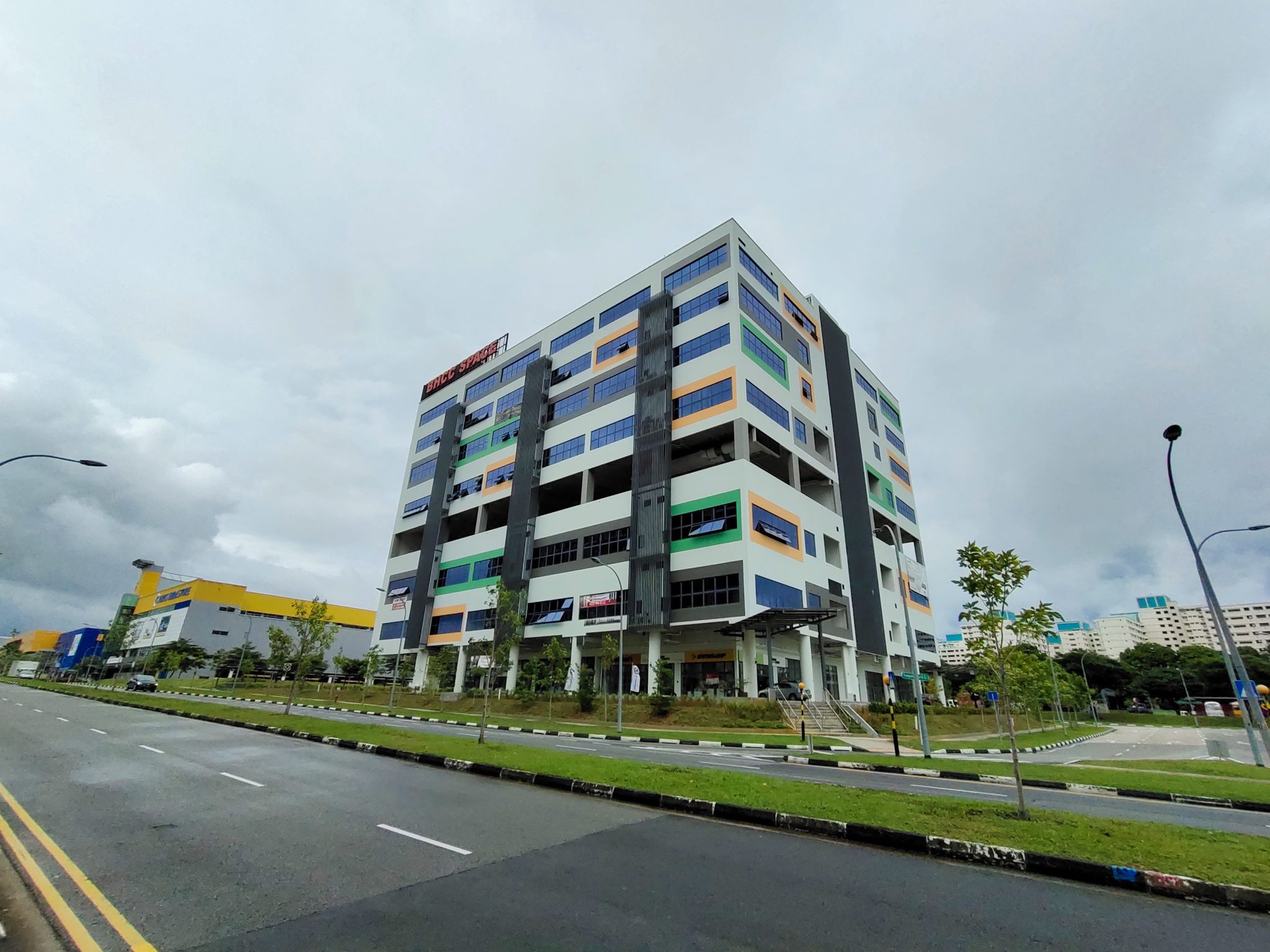 A multi-storey building beside a road at the standard 1x zoom