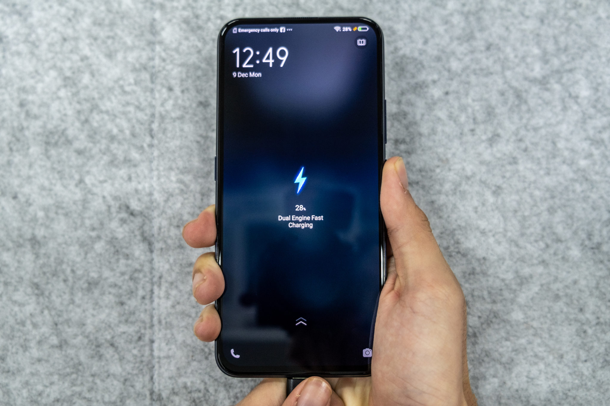 The Vivo V17 Pro on its charger showing the charging screen