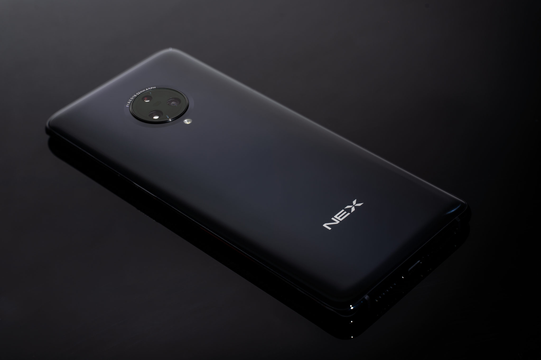 The black back of the Vivo Nex 3 with its triple camera and Nex logo