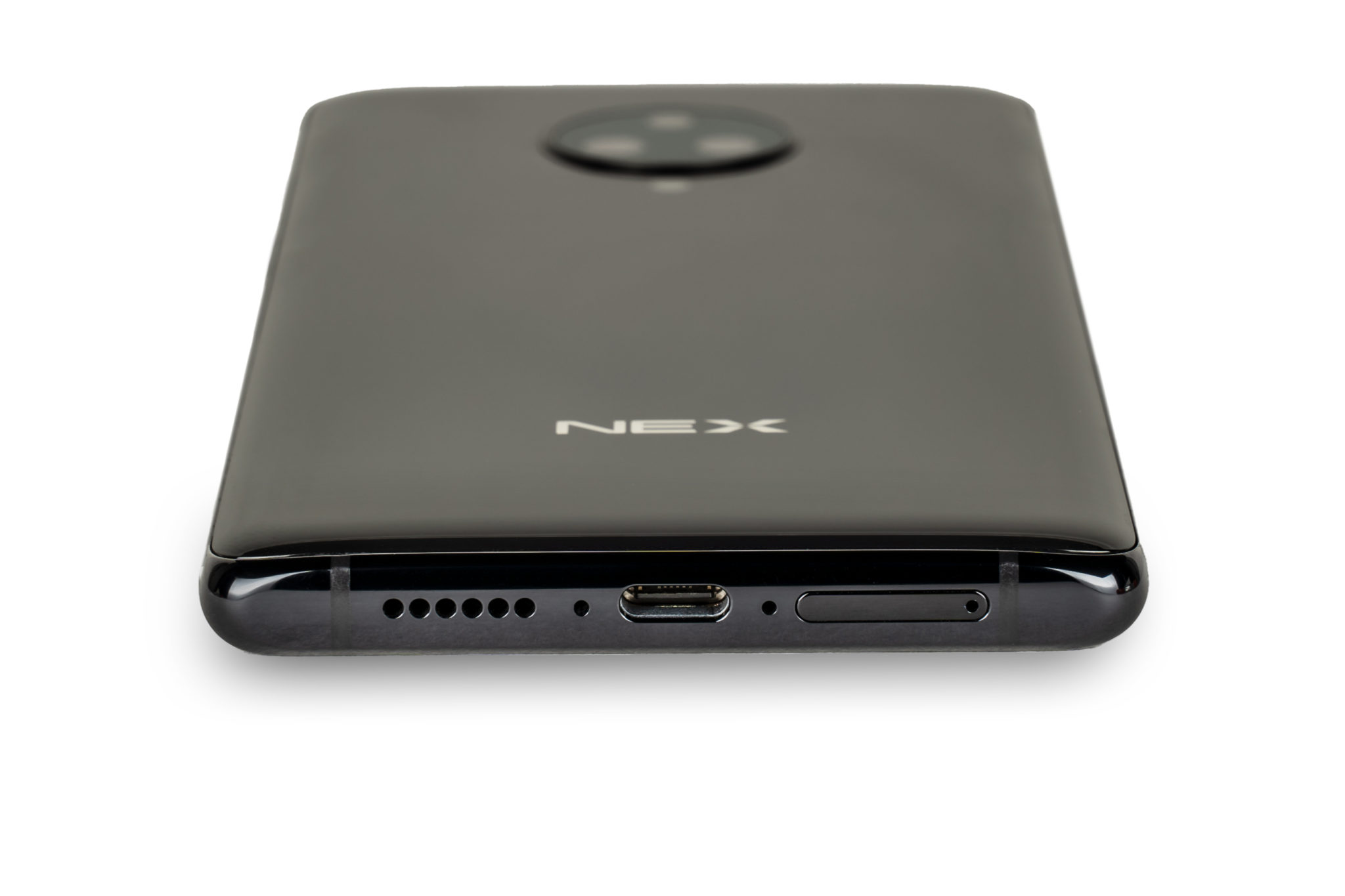 The Vivo Nex 3 lying on its front showing the speaker grille and USB-C port on its bottom edge
