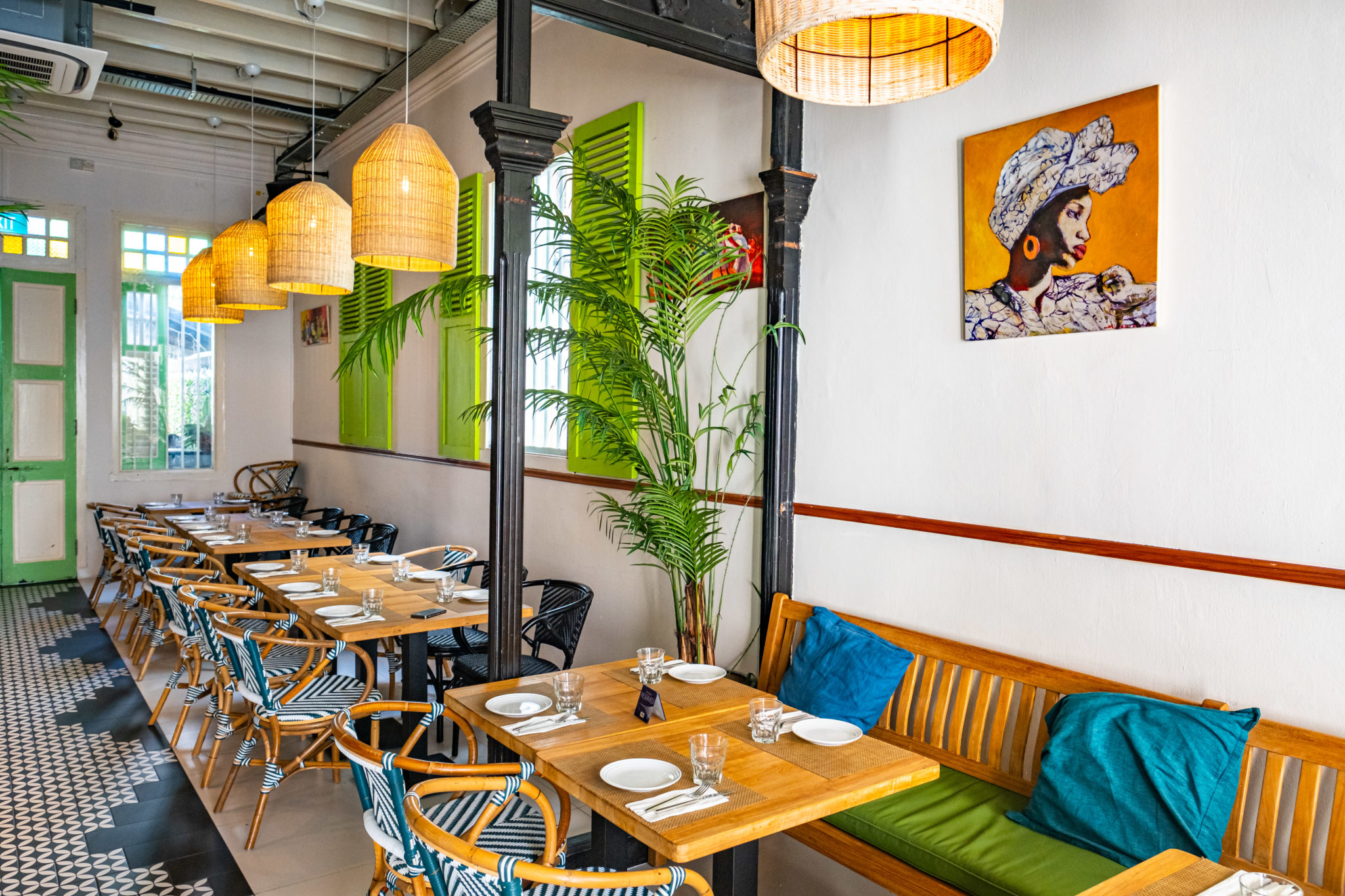 The Lime House dining room with wooden tables and green accents