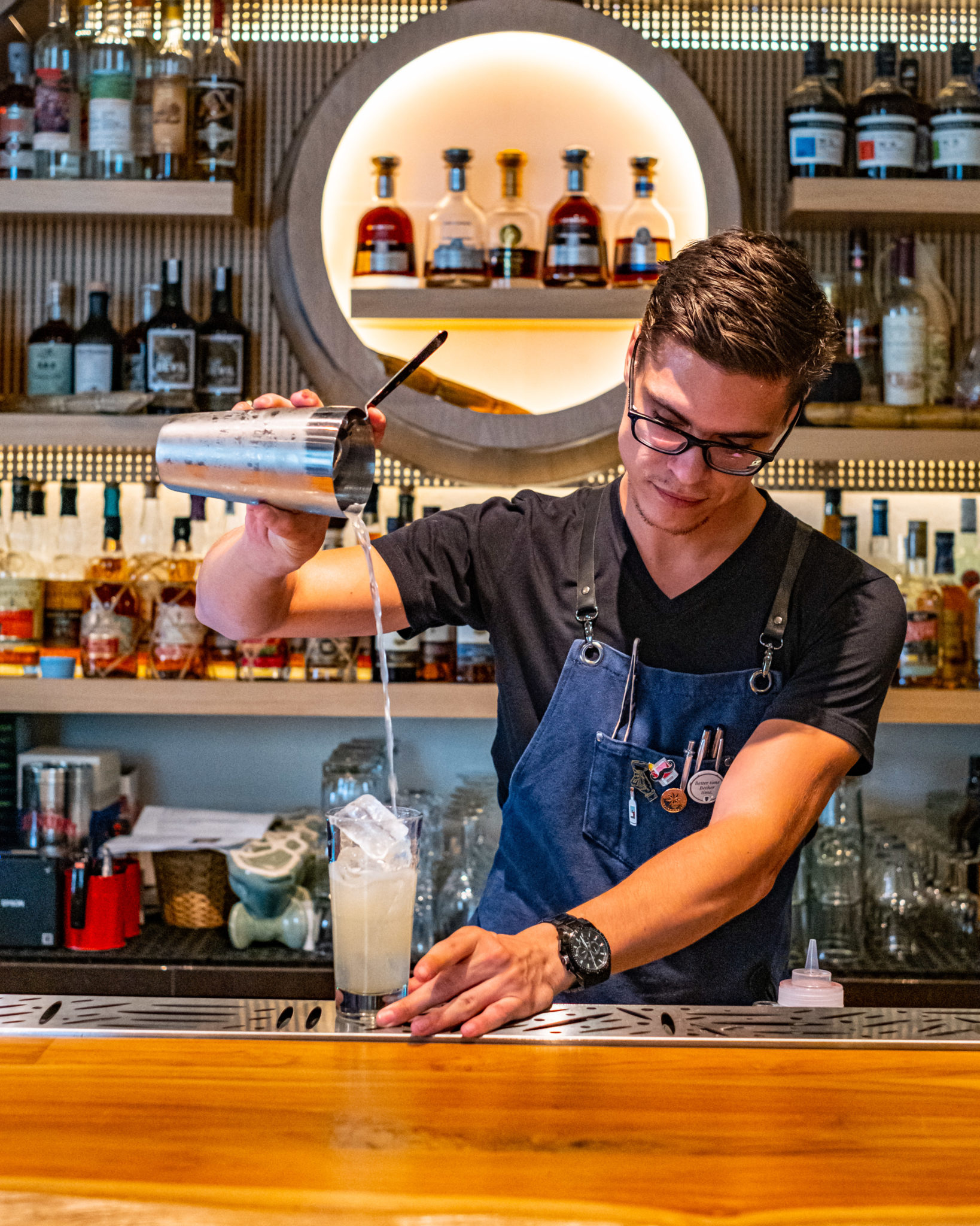 A bartender shaking a cocktail at the Lime House bar