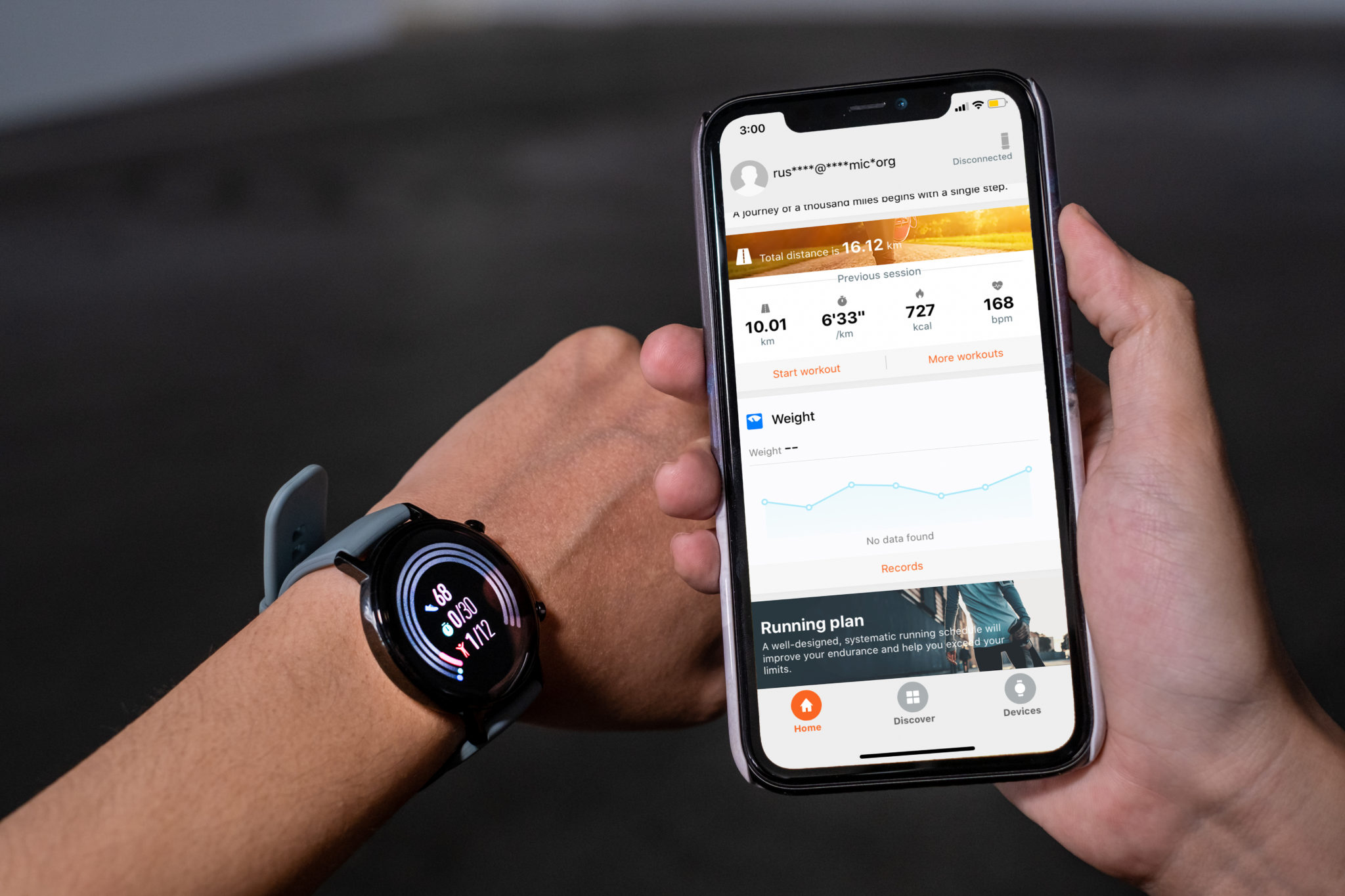A phone showing a running plan in the Huawei Health app beside a wrist wearing the watch