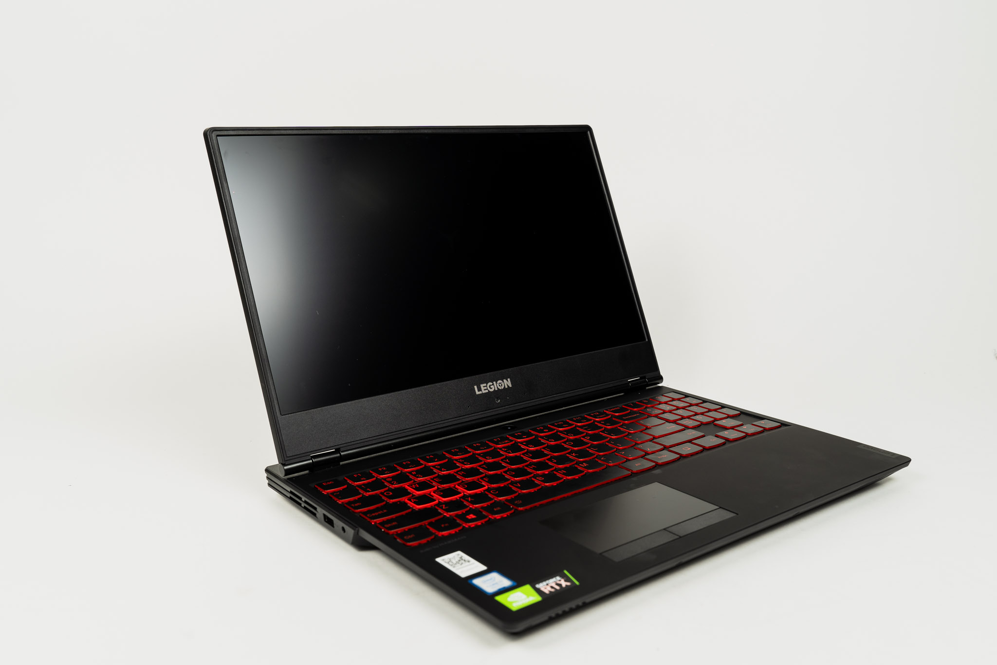 The Legion Y7000 SE open on a white background with a red-lit keyboard