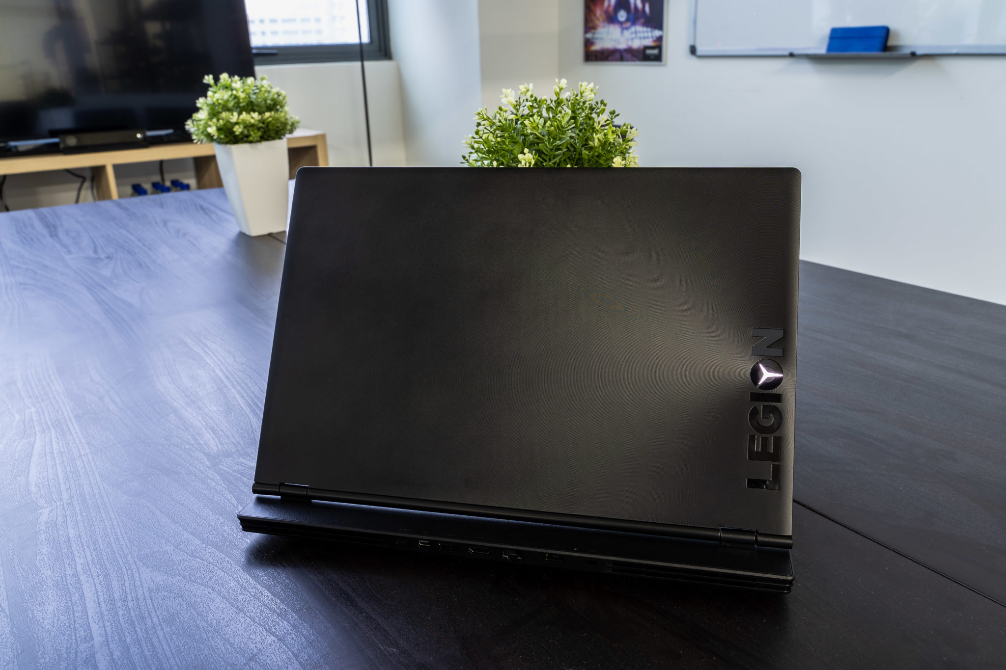 The textured lid of the Legion Y540 with the Legion name along its edge