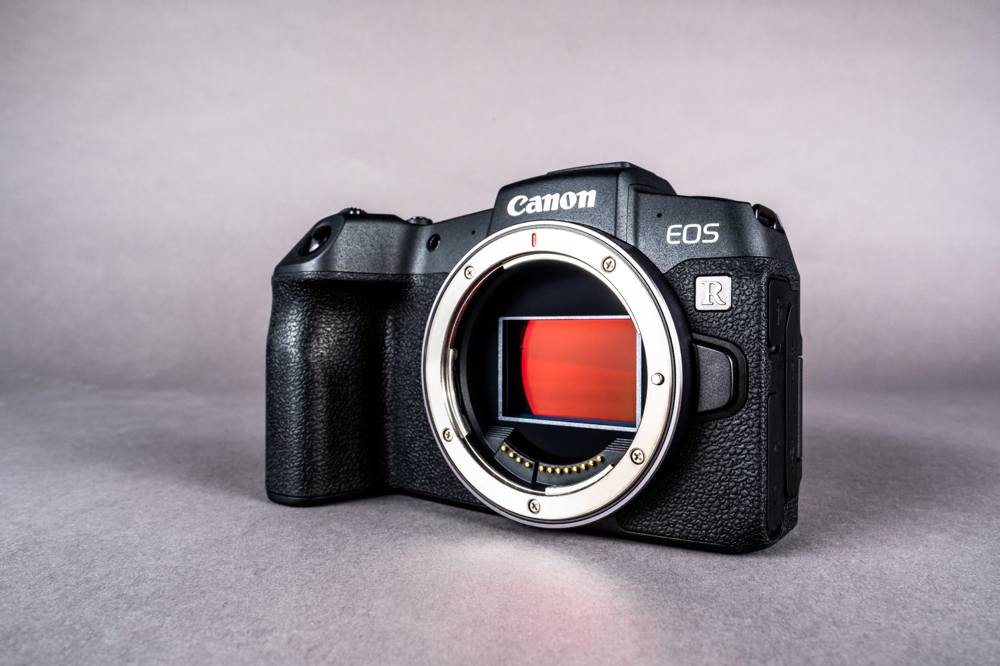The Canon EOS RP body without a lens, showing the sensor behind the mount