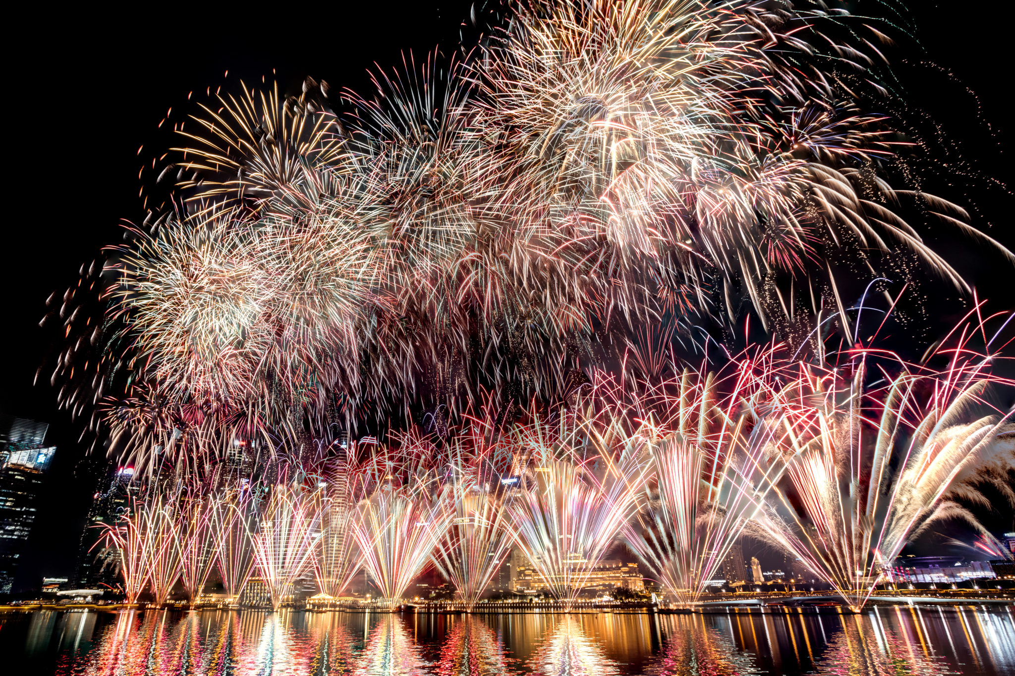 Fireworks reflected on the water at night, shot on the EOS RP