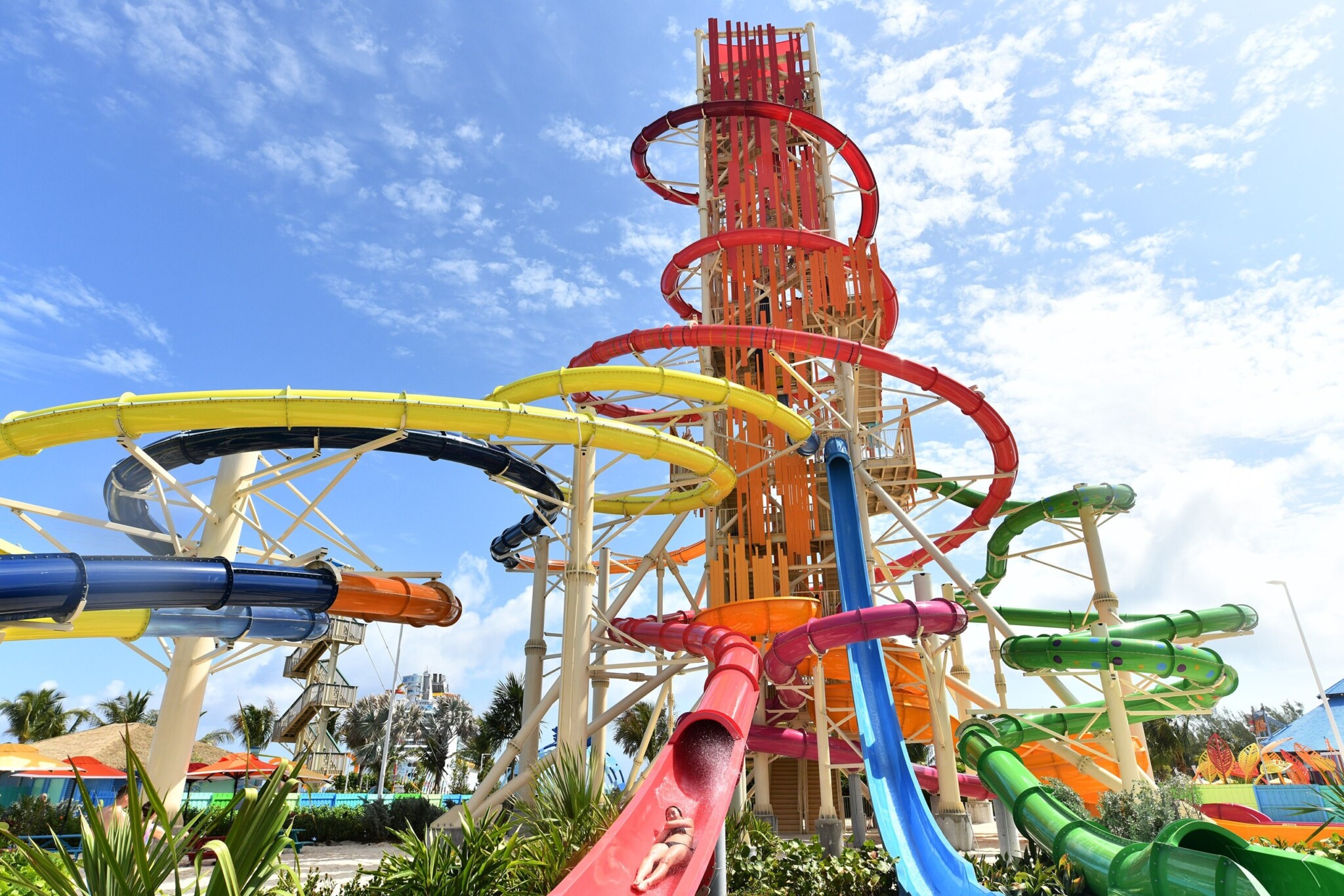 A tall colourful waterslide tower rises above the waterpark at Perfect Day at CocoCay.