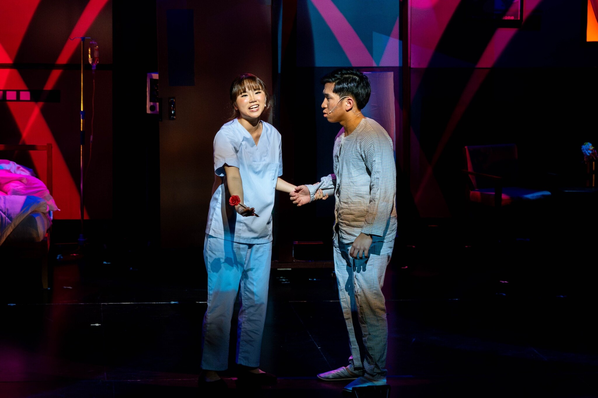 Two performers act on stage in Senjakala: A Musical.