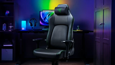 Razer Clio X speaker head cushion on a high-back gaming chair in an RGB-lit setup