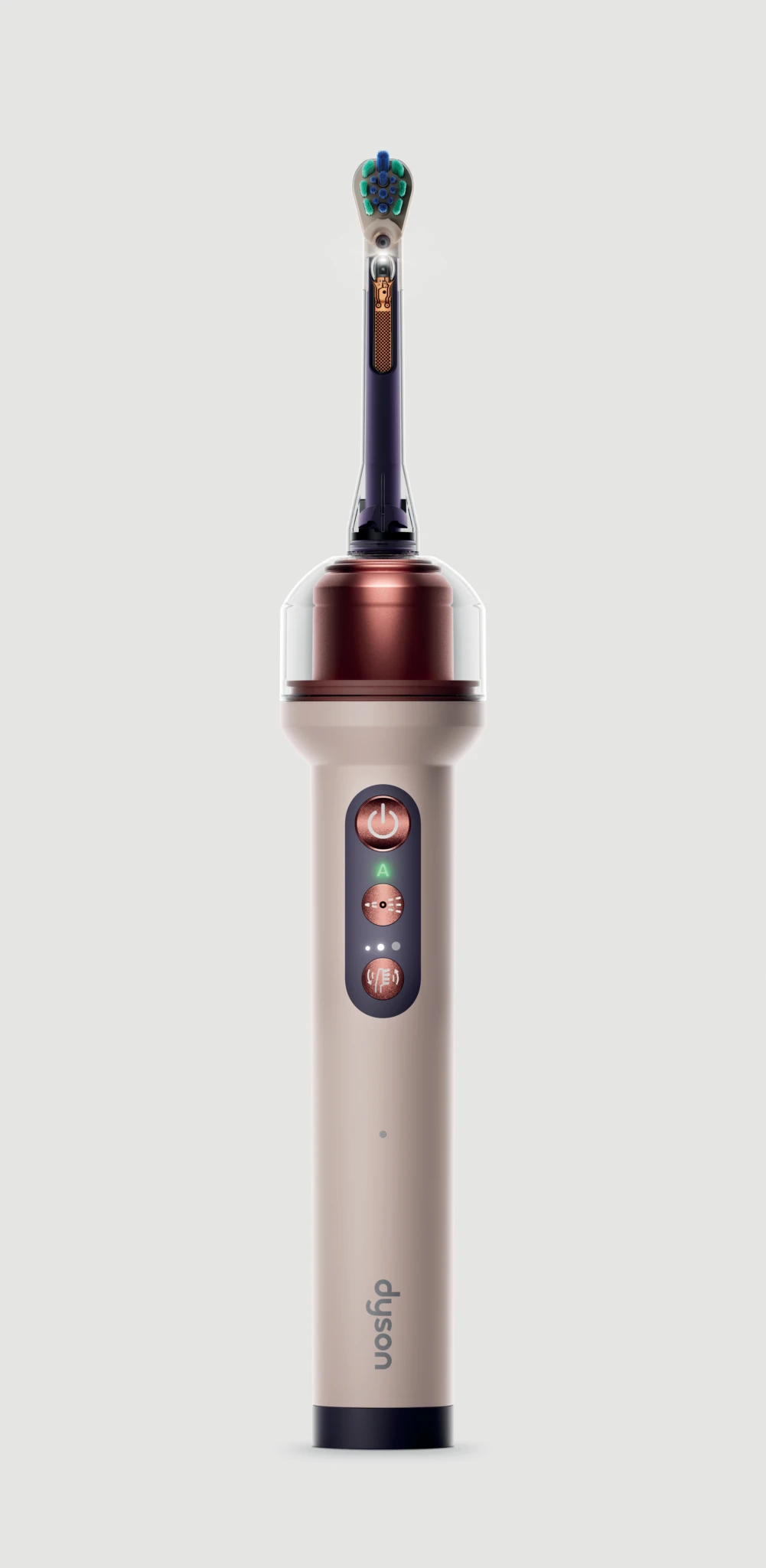 Dyson CameraJet toothbrush with cream handle and teal bristles on its copper charging base