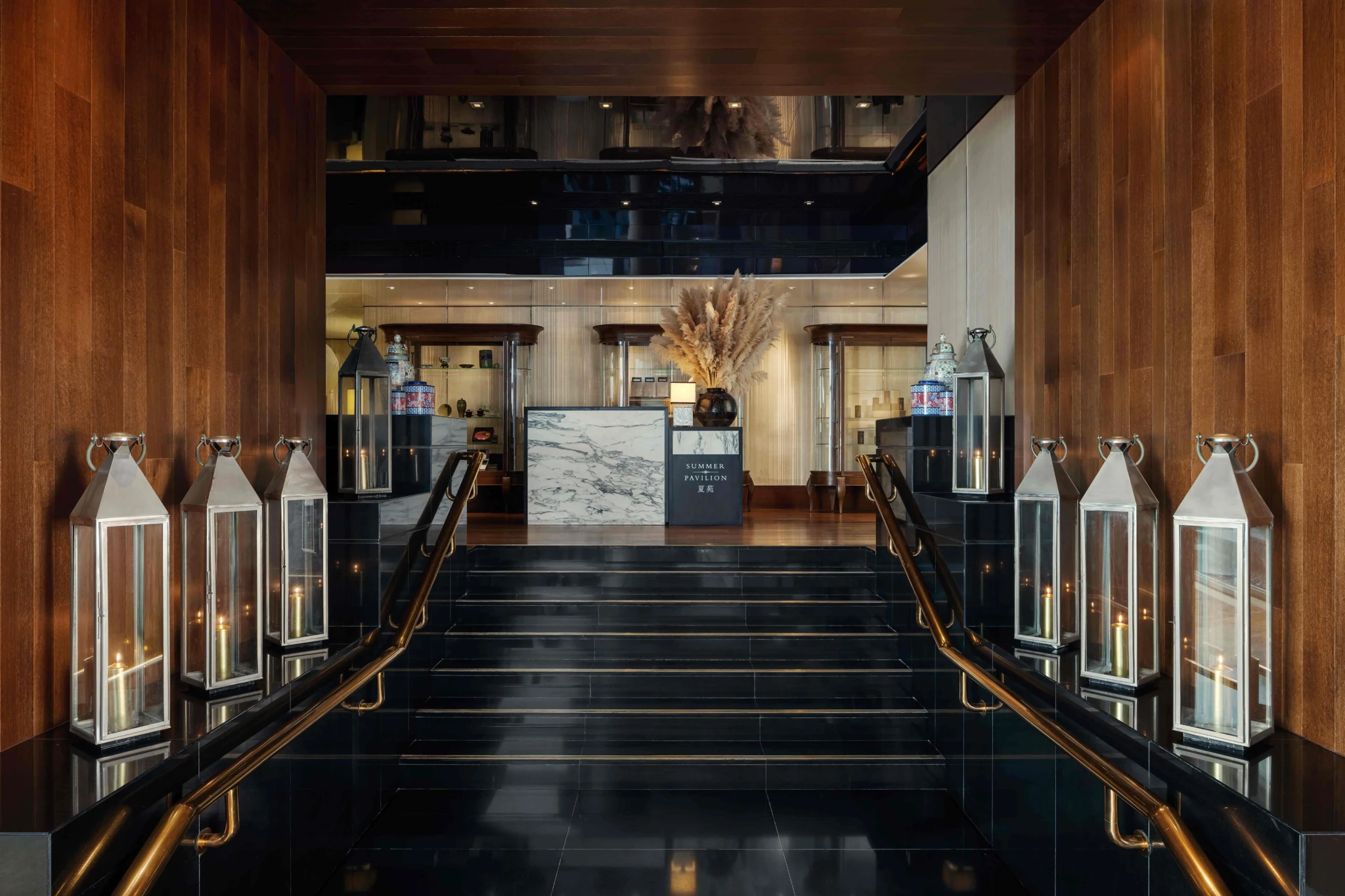 Summer Pavilion's entrance with marble signage, lanterns and golden handrails