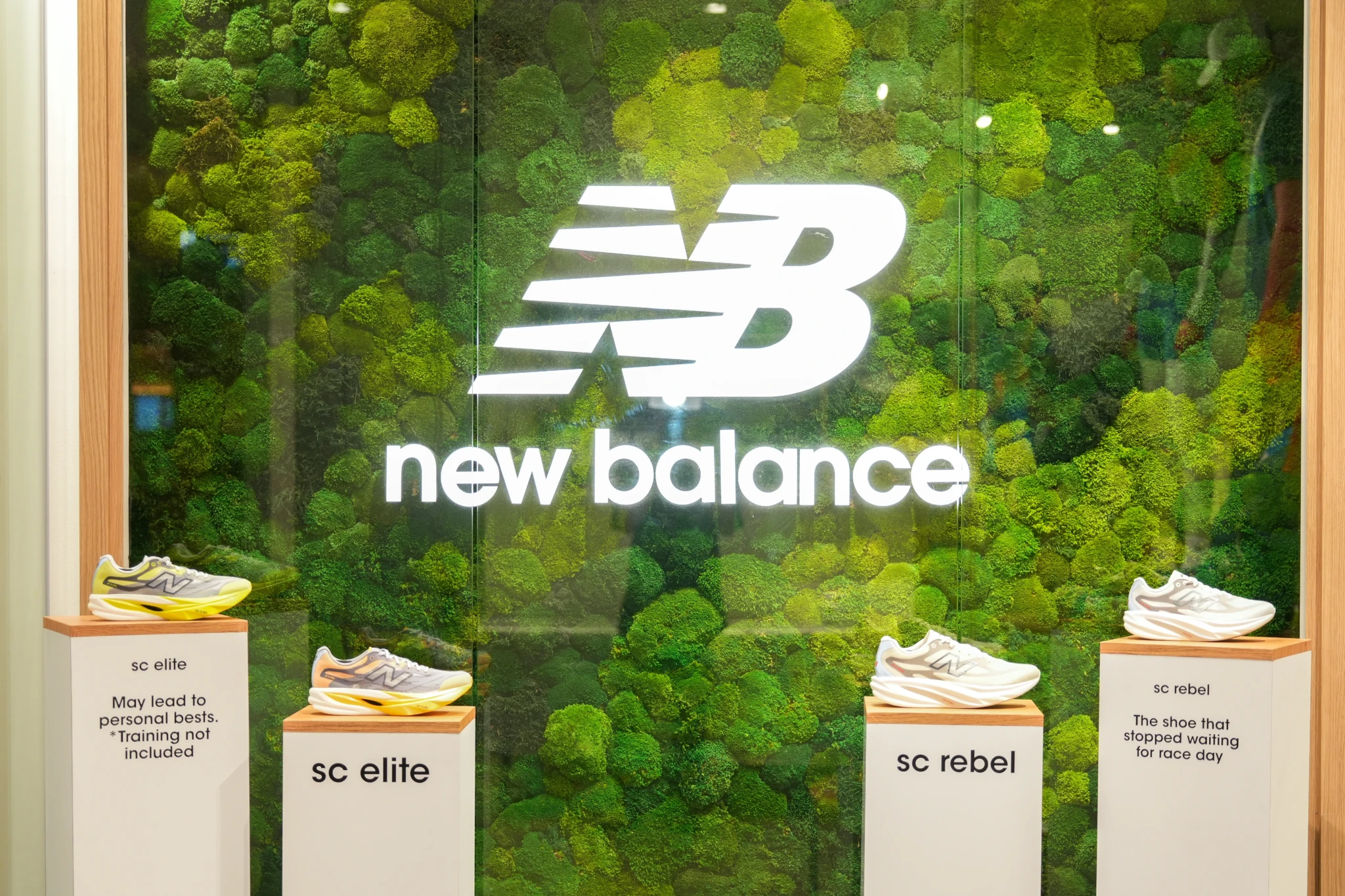 New Balance SuperComp Rebel and SuperComp Elite shoes displayed on pedestals at the Suntec City trial venue