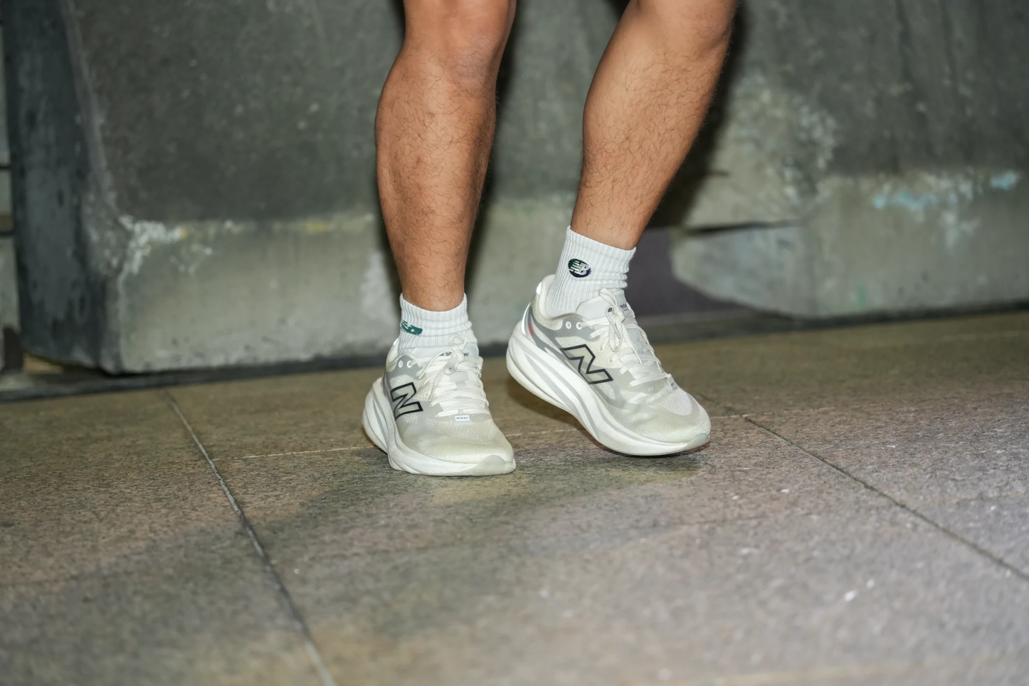 A runner wears white New Balance running shoes during the trial programme at Suntec City