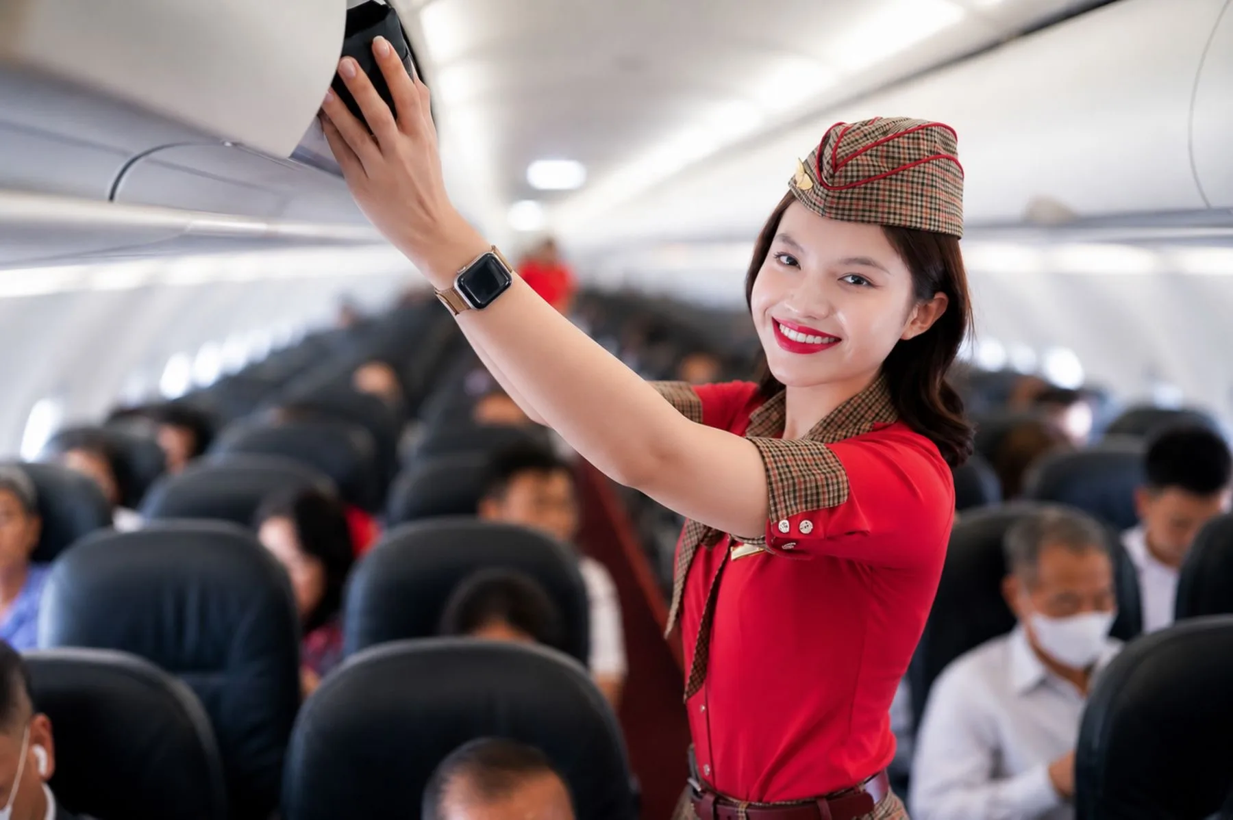 A Vietjet flight attendant takes a selfie aboard an aircraft during the 9.9 sale