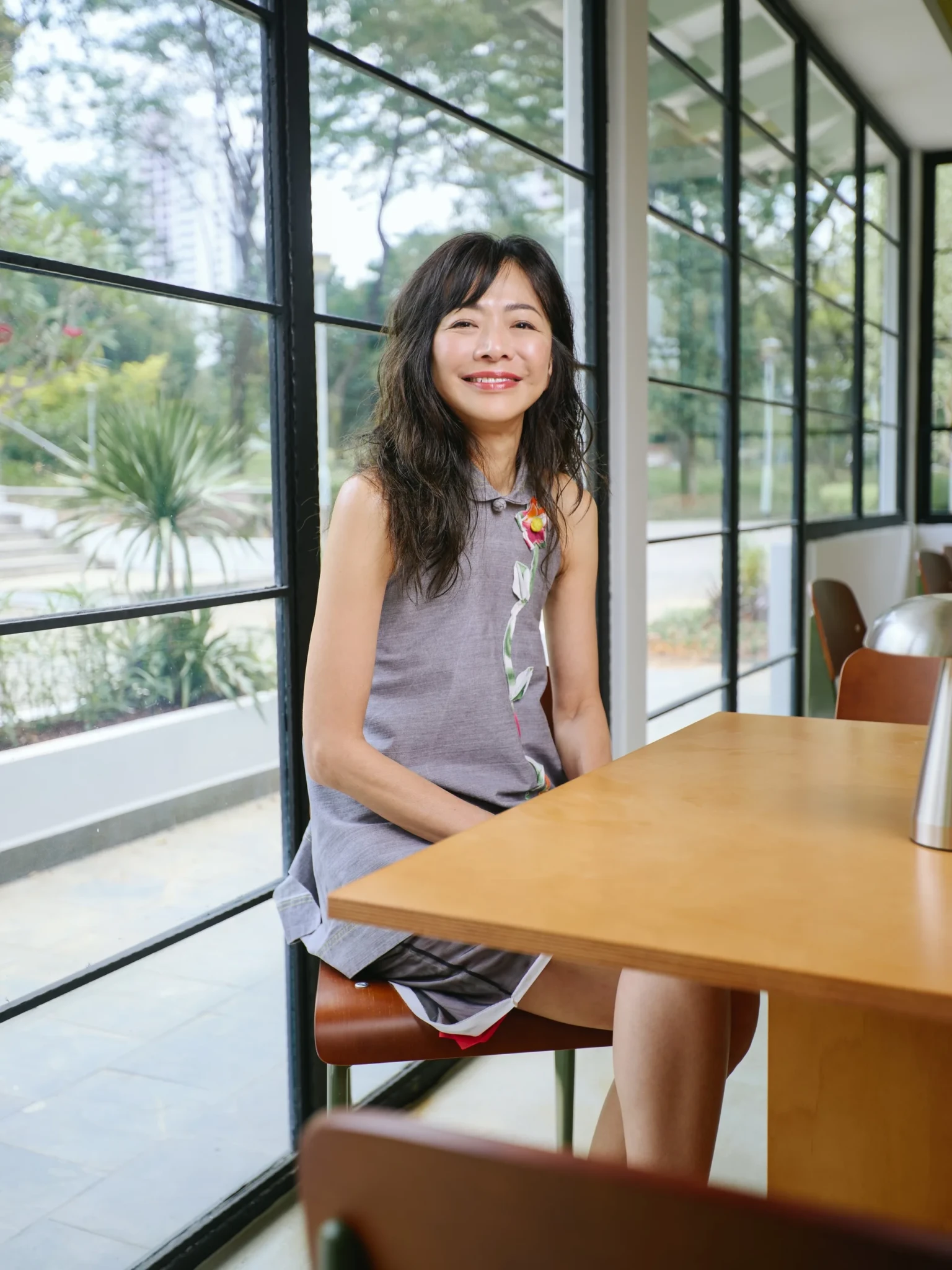A co-founder of Shared Table seated inside the parkside café ahead of its September 2026 opening