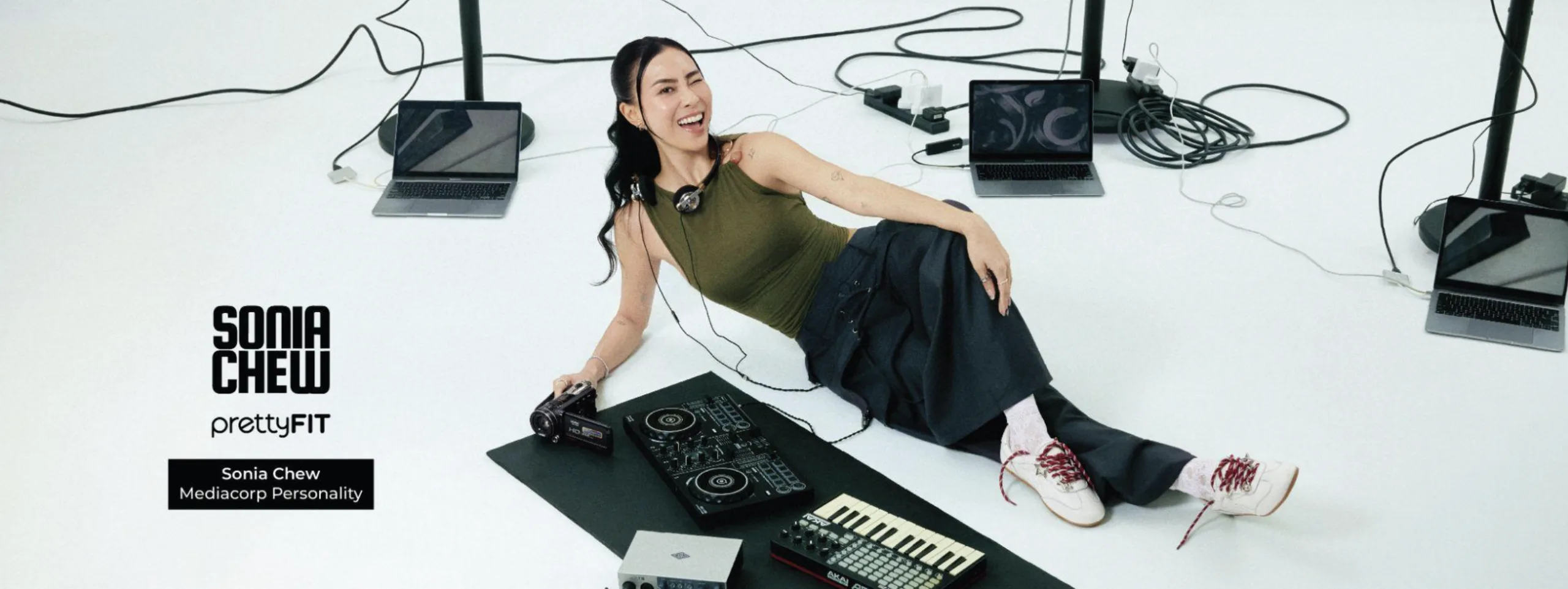 Sonia Chew models a white canvas shoe with burgundy lacing from her prettyFIT collaboration 