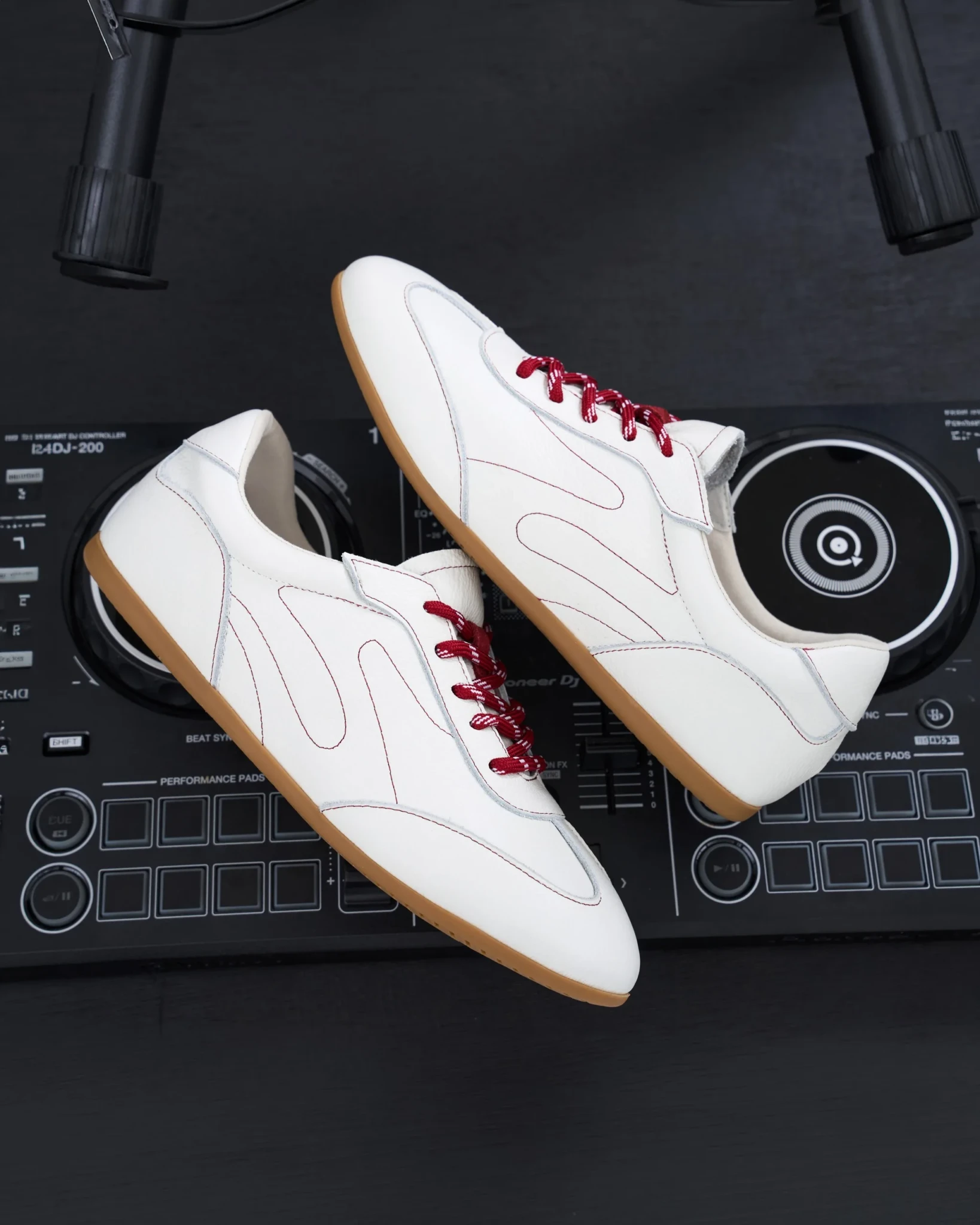 The Billie Sneakers in the Panna Cotta colourway styled on DJ equipment
