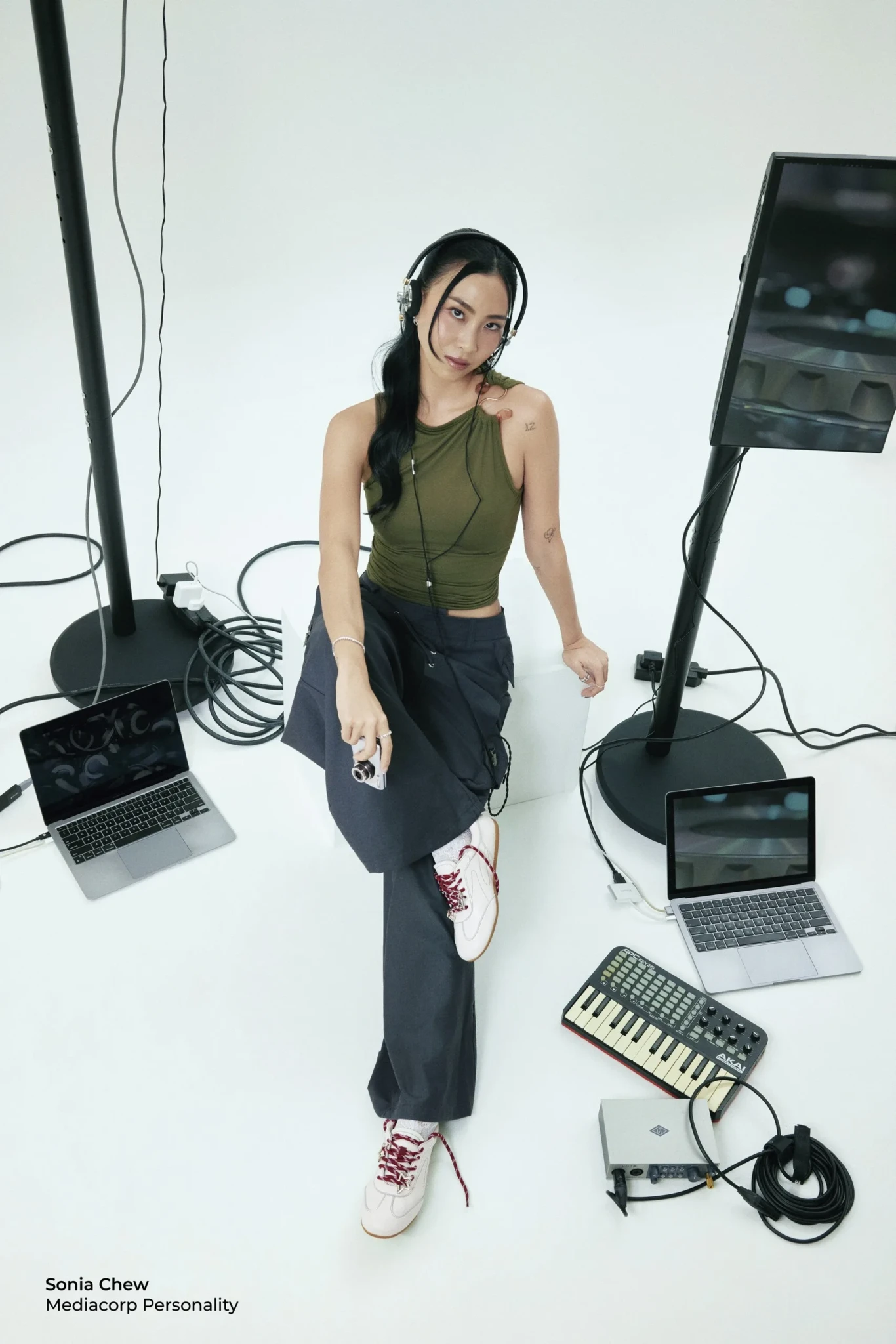 Sonia Chew at her DJ setup wearing the Billie Sneakers from her prettyFIT collaboration