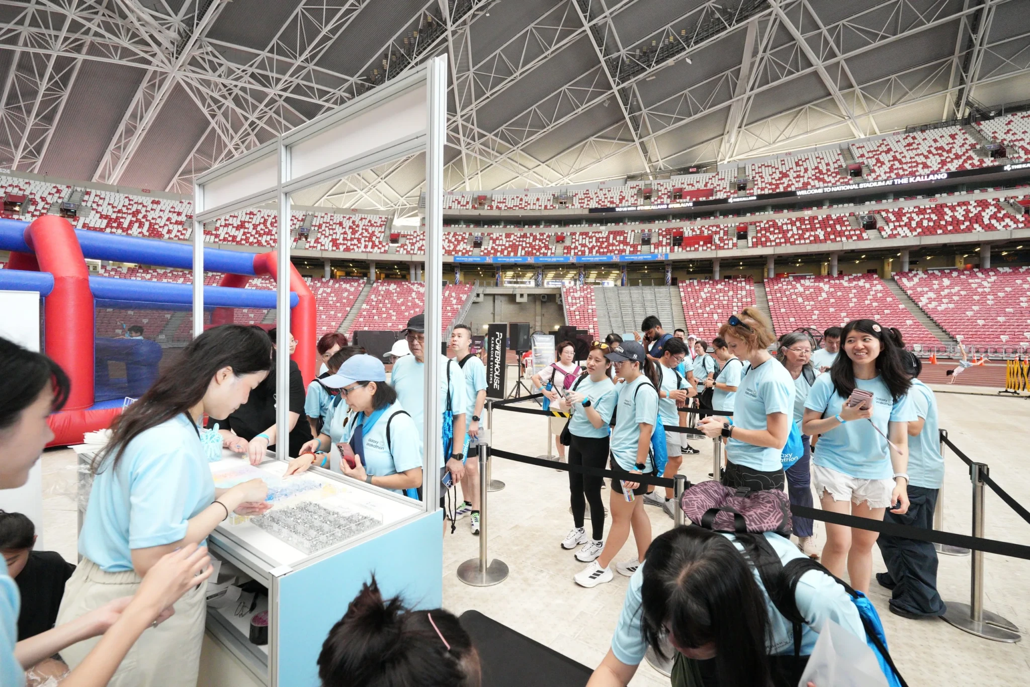 Participants explore activity stations at the Walkers' Village during Samsung Singapore's Galaxy Walkathon