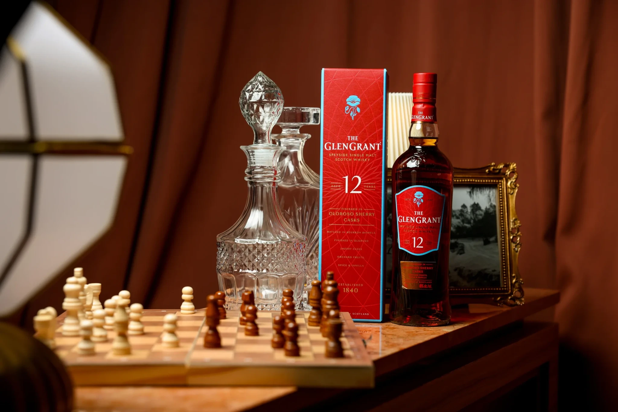 The Glen Grant 12-Year-Old Sherry Finish with its red gift box and a crystal decanter