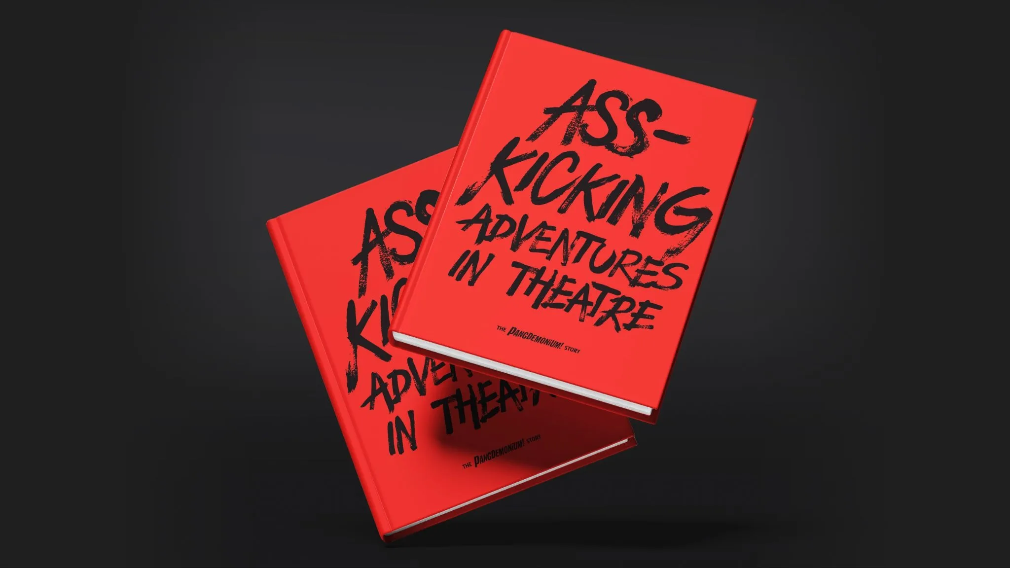 Two copies of Ass-Kicking Adventures in Theatre: The Pangdemonium Story, the limited-edition commemorative book