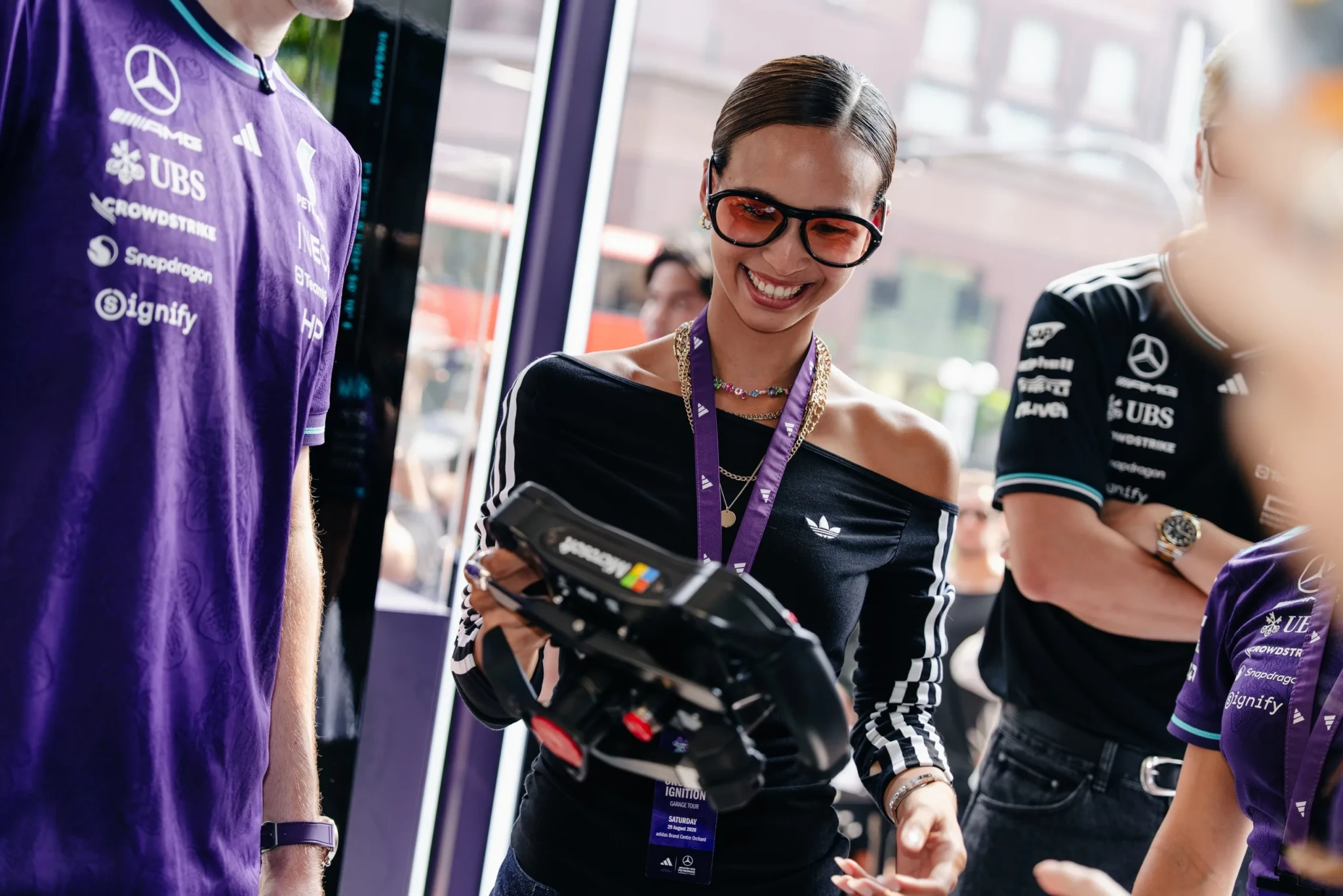 An attendee holding a gaming controller at the Guided Garage Tour