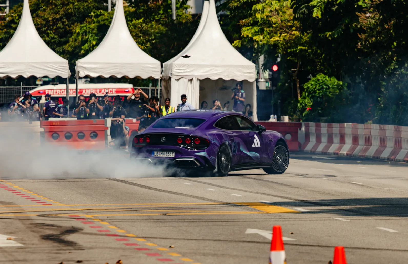 Mercedes-AMG GT 4-Door Coupé drifting with tyre smoke on Orchard Road