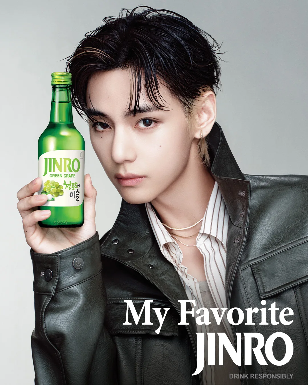 V of BTS holding a bottle of JINRO Green Grape soju