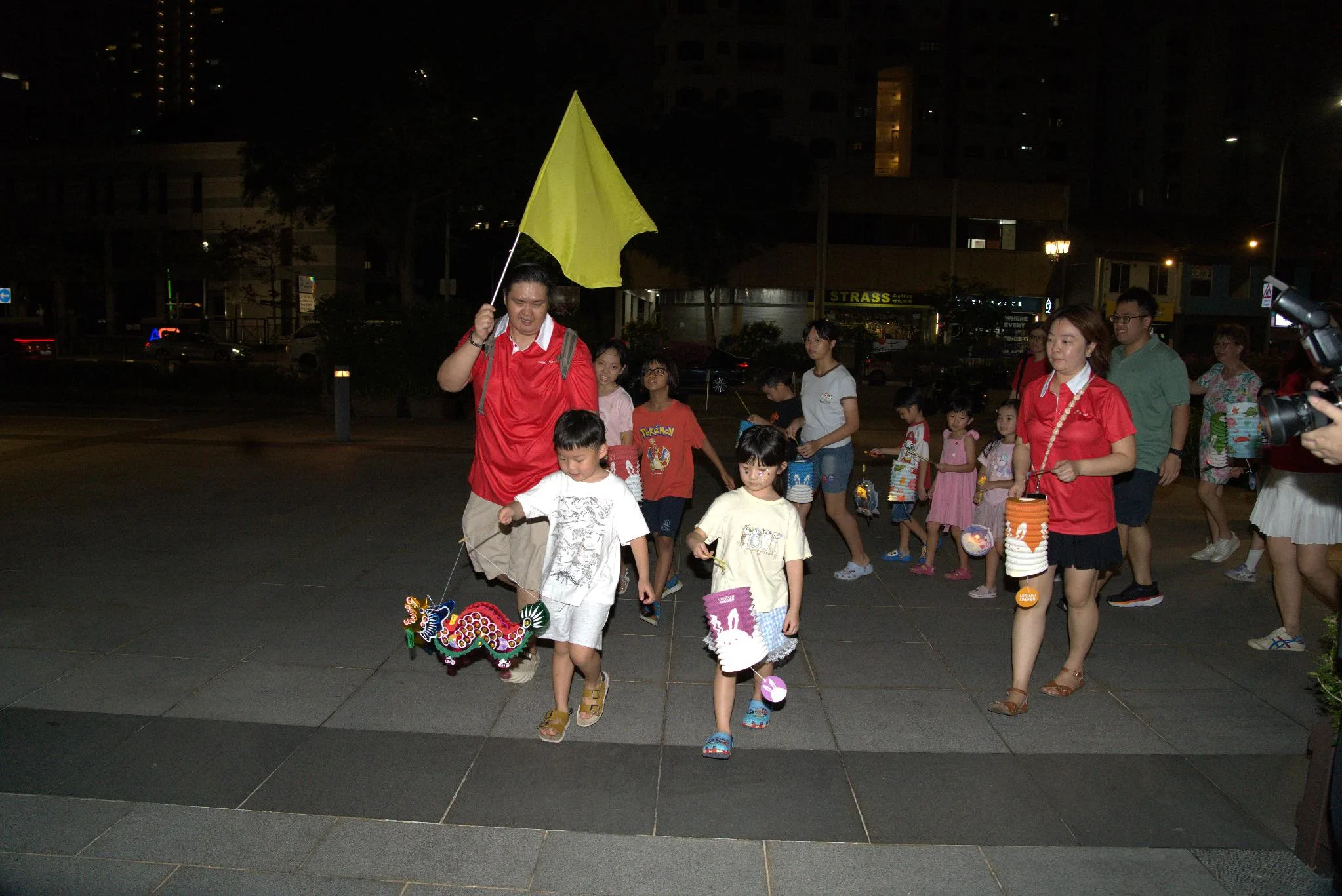 Participants holding lanterns during the Mid-Autumn lantern walk at PAssionArts Festival 2026