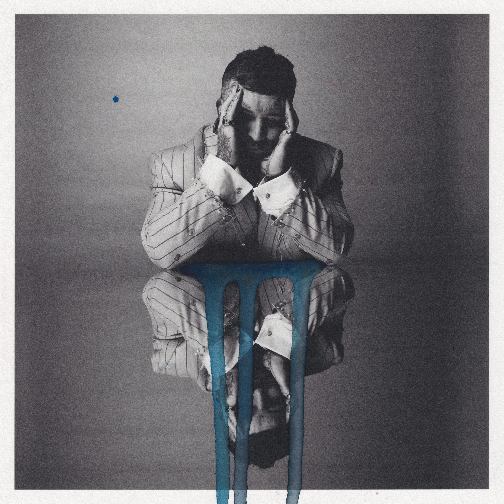 Teddy Swims on the Ugly cover artwork, in a pinstriped suit framing his face with both hands