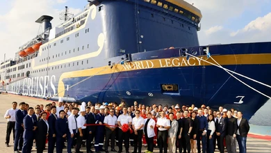 World Legacy docked in Singapore with crew and officials gathered for the relaunch
