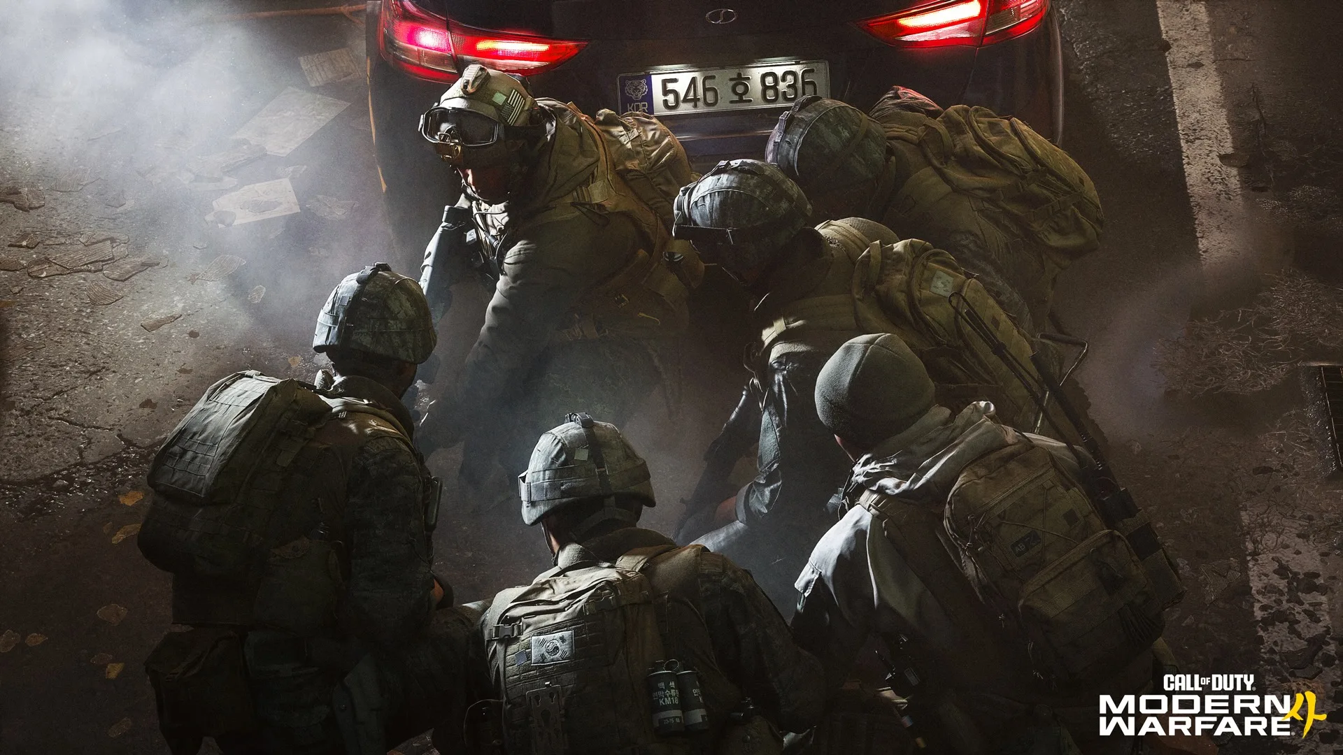 Task Force 141 soldiers staging an operation beneath an armoured vehicle