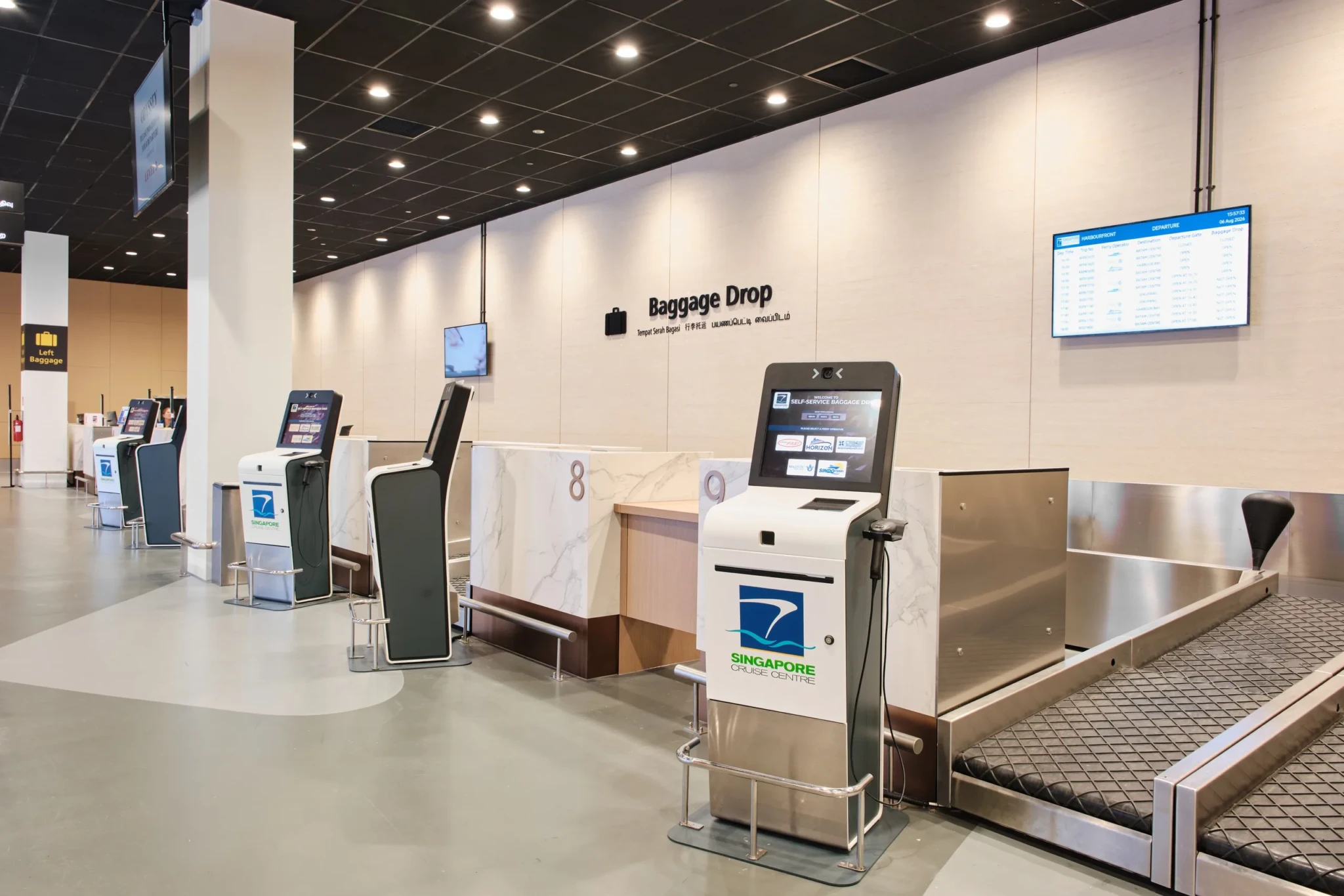Self-service baggage drop kiosks lined up at the new HarbourFront terminal