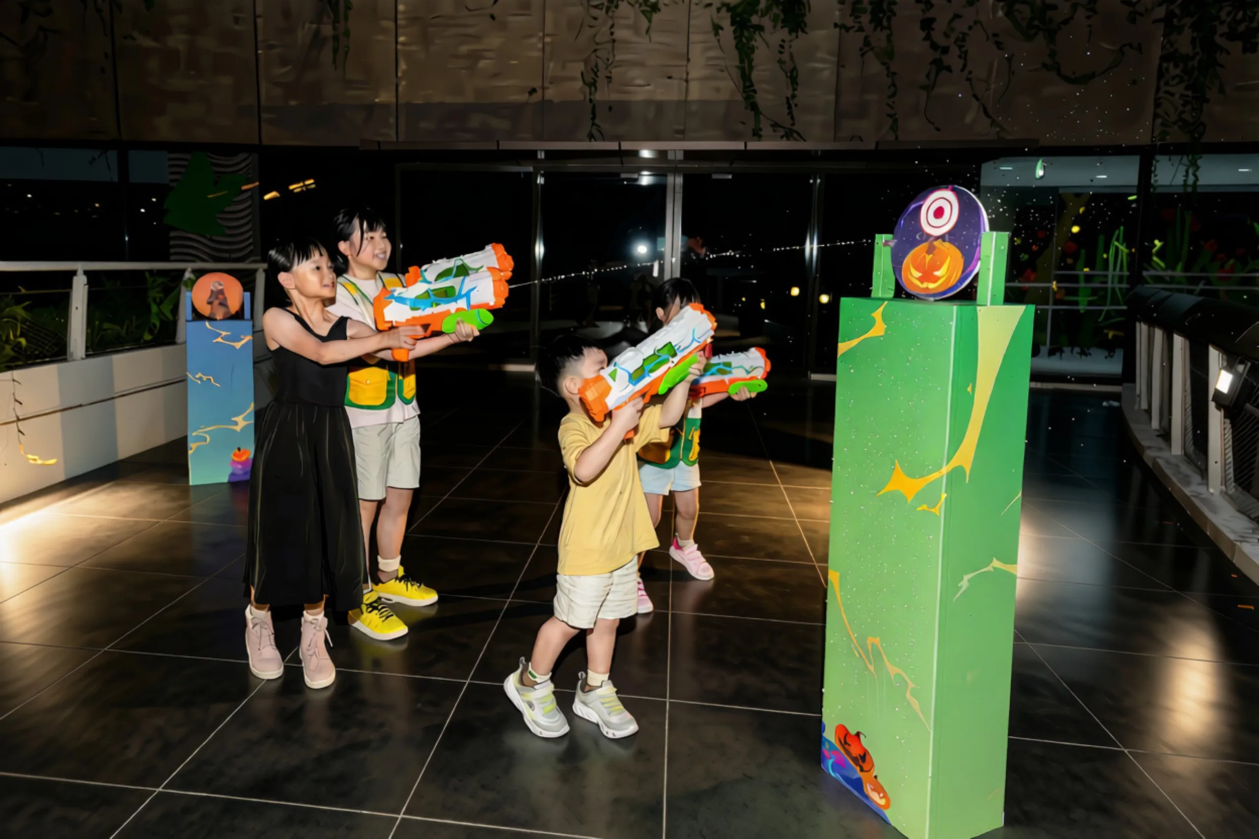 Young Ranger Buddies aiming at pumpkin targets during Pumpkin Blast