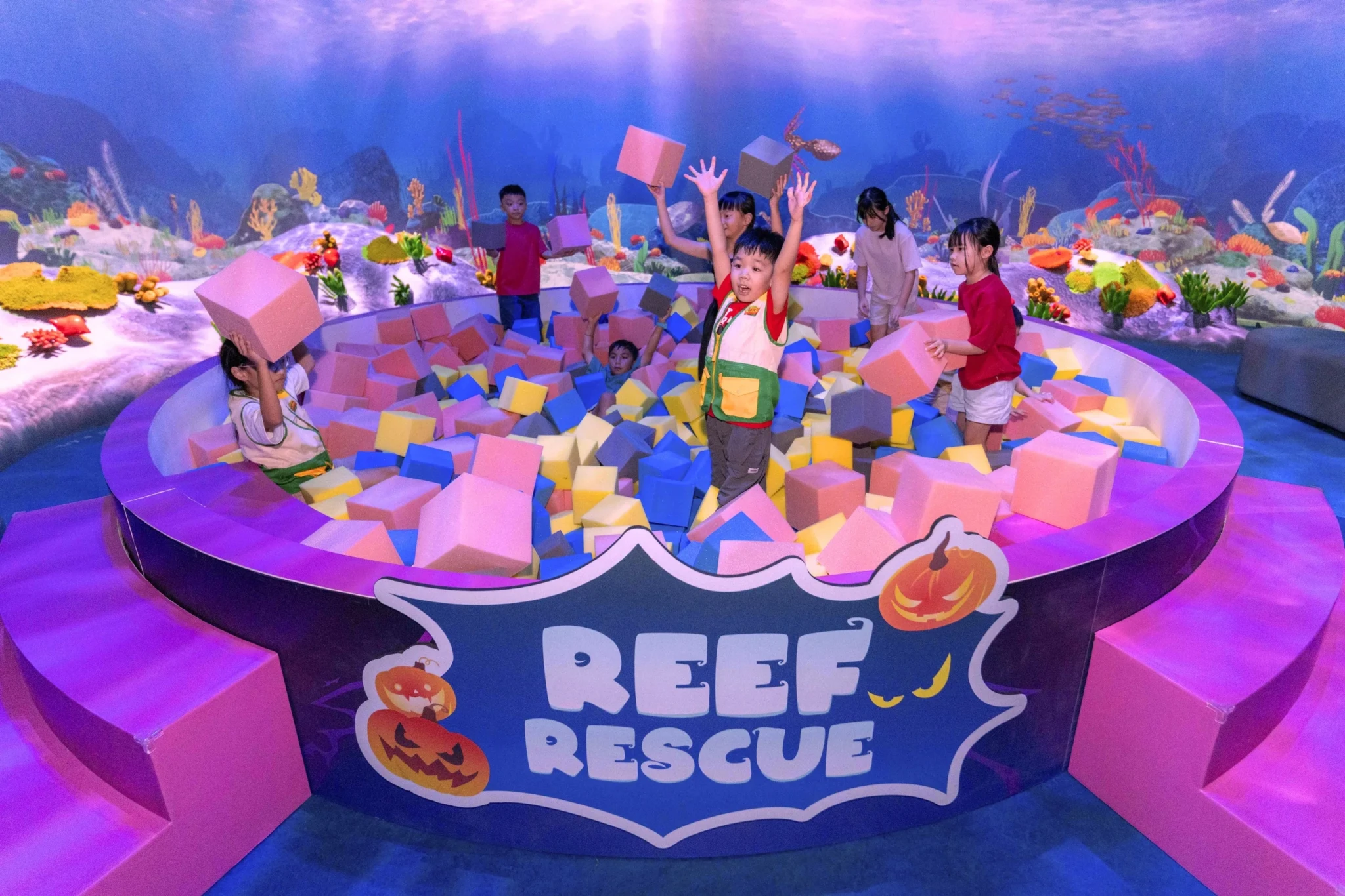 Children piecing together clues to restore the Sea Jelly or Octopus during Reef Rescue