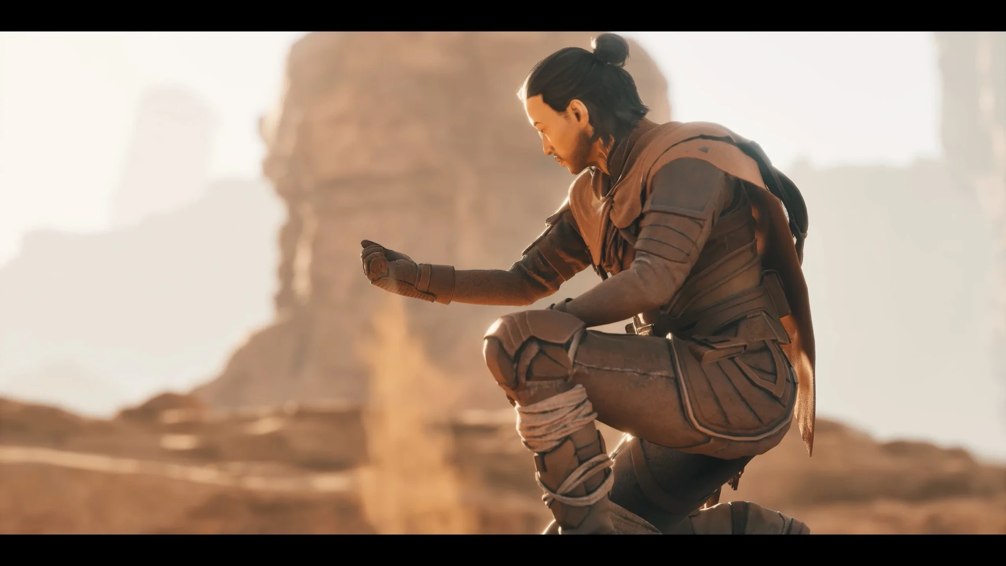 A lone player crouches on the desert floor of Arrakis in Dune: Awakening