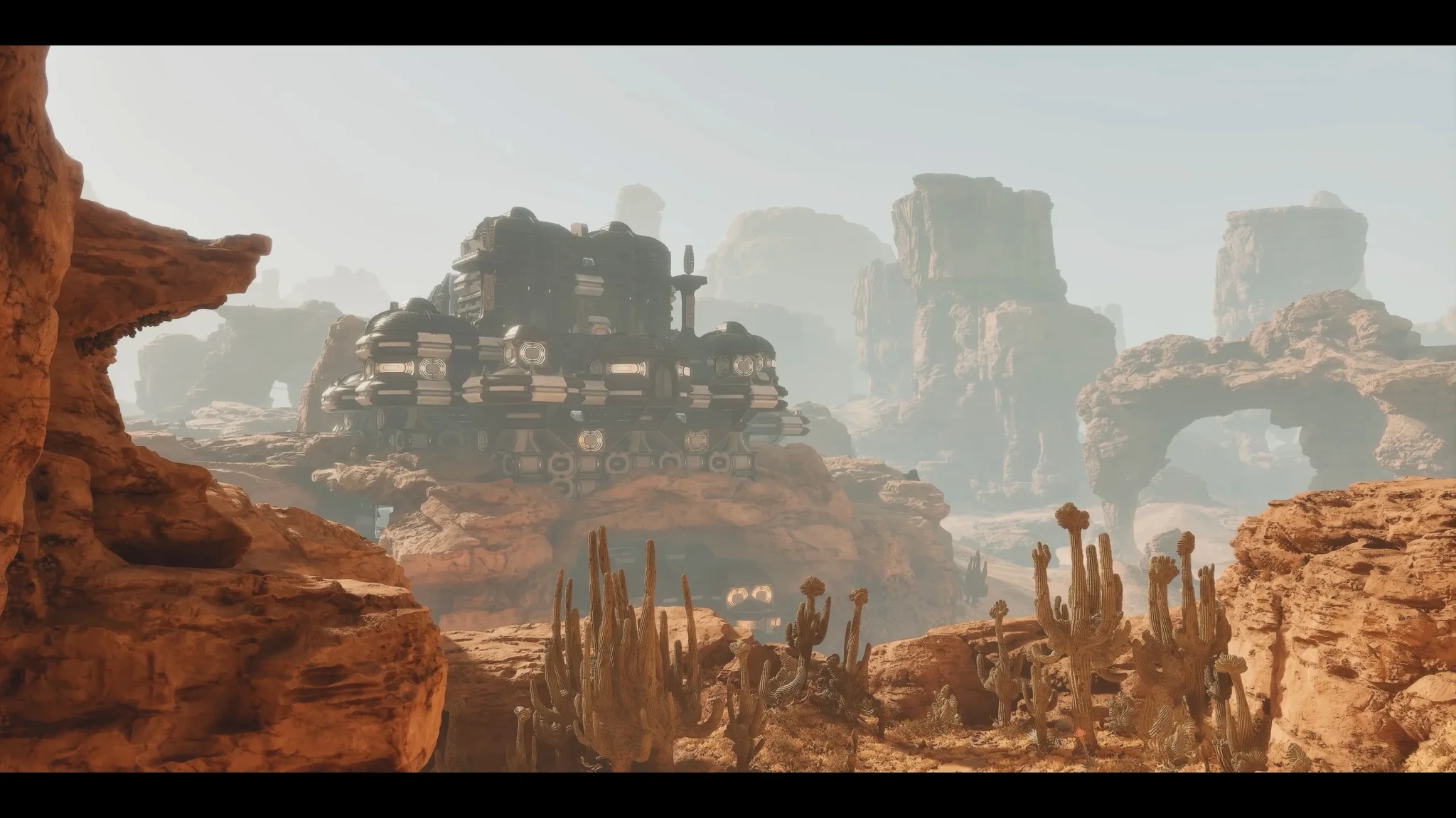 A dark facility on a rock outcrop above the desert of Arrakis in Dune: Awakening